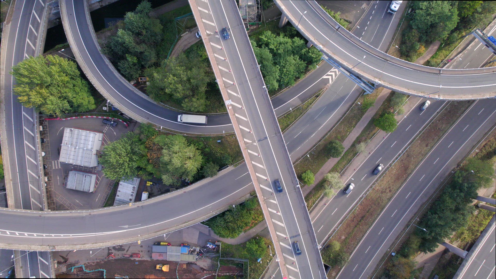 Vehicles Driving on a Spaghetti Interchange Bird's Eye Aerial View