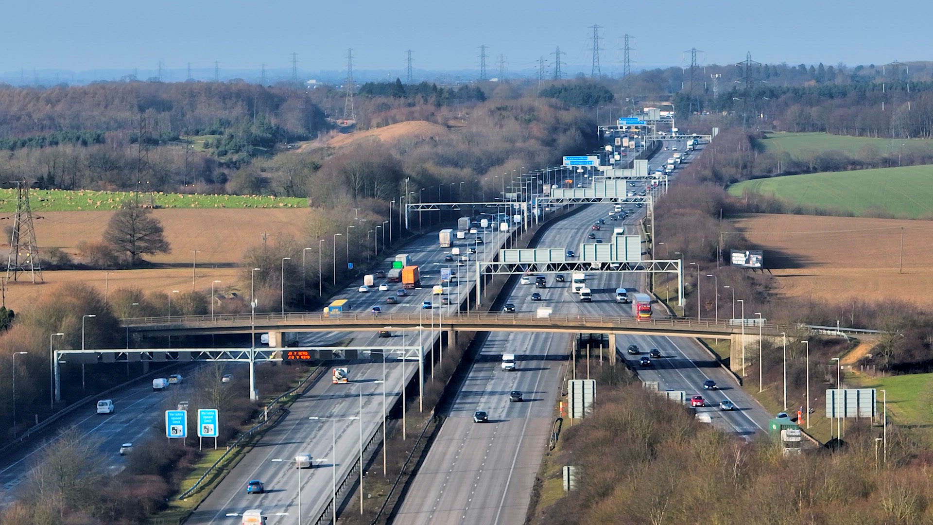 M25 Motorway Junction With Vehicles Driving Aerial View