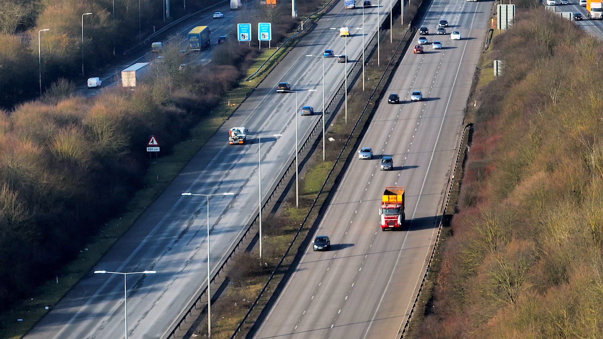 M25 Motorway Junction With Vehicles Driving Aerial View
