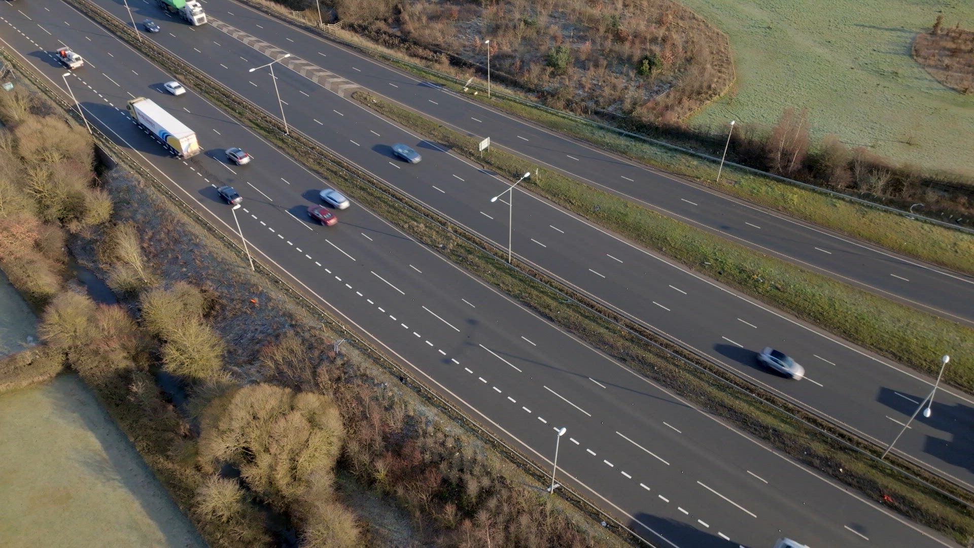 Lorries, Cars and Vehicles Driving on a UK Motorway Aerial View