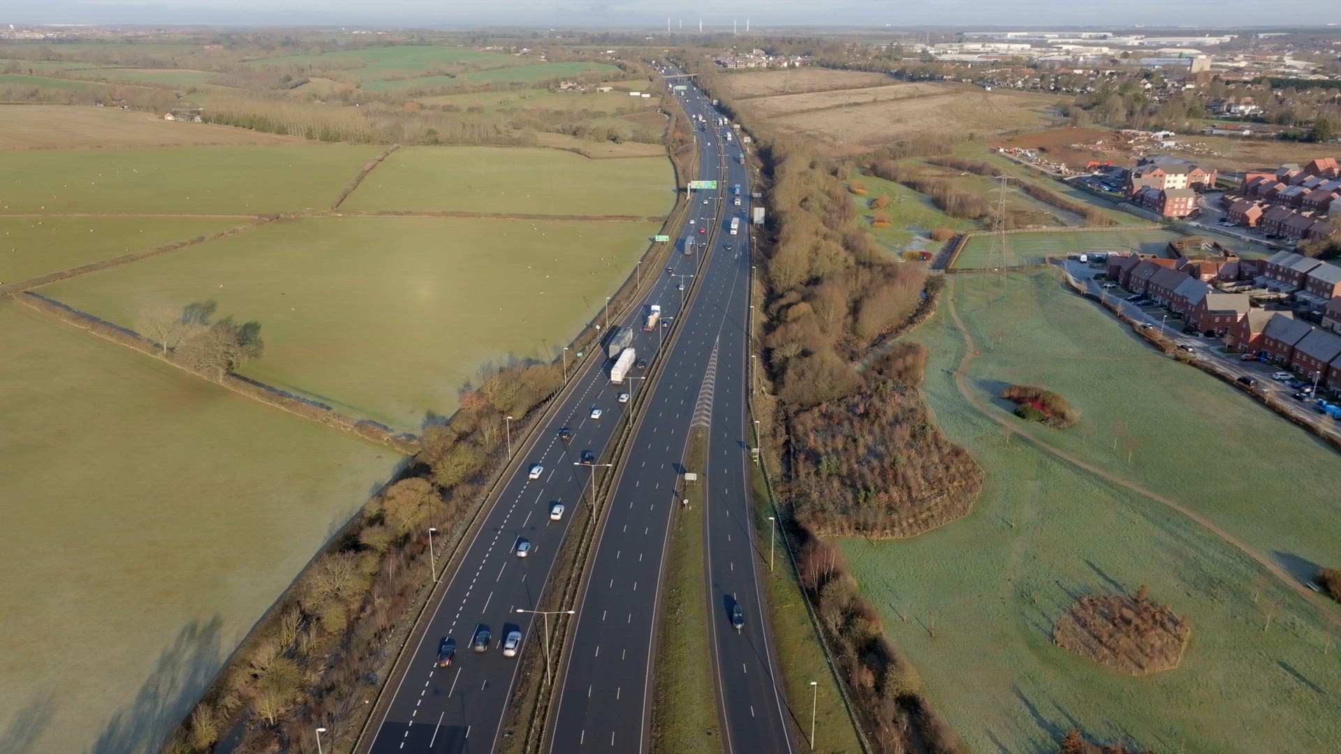 Lorries, Cars and Vehicles Driving on a UK Motorway Aerial View
