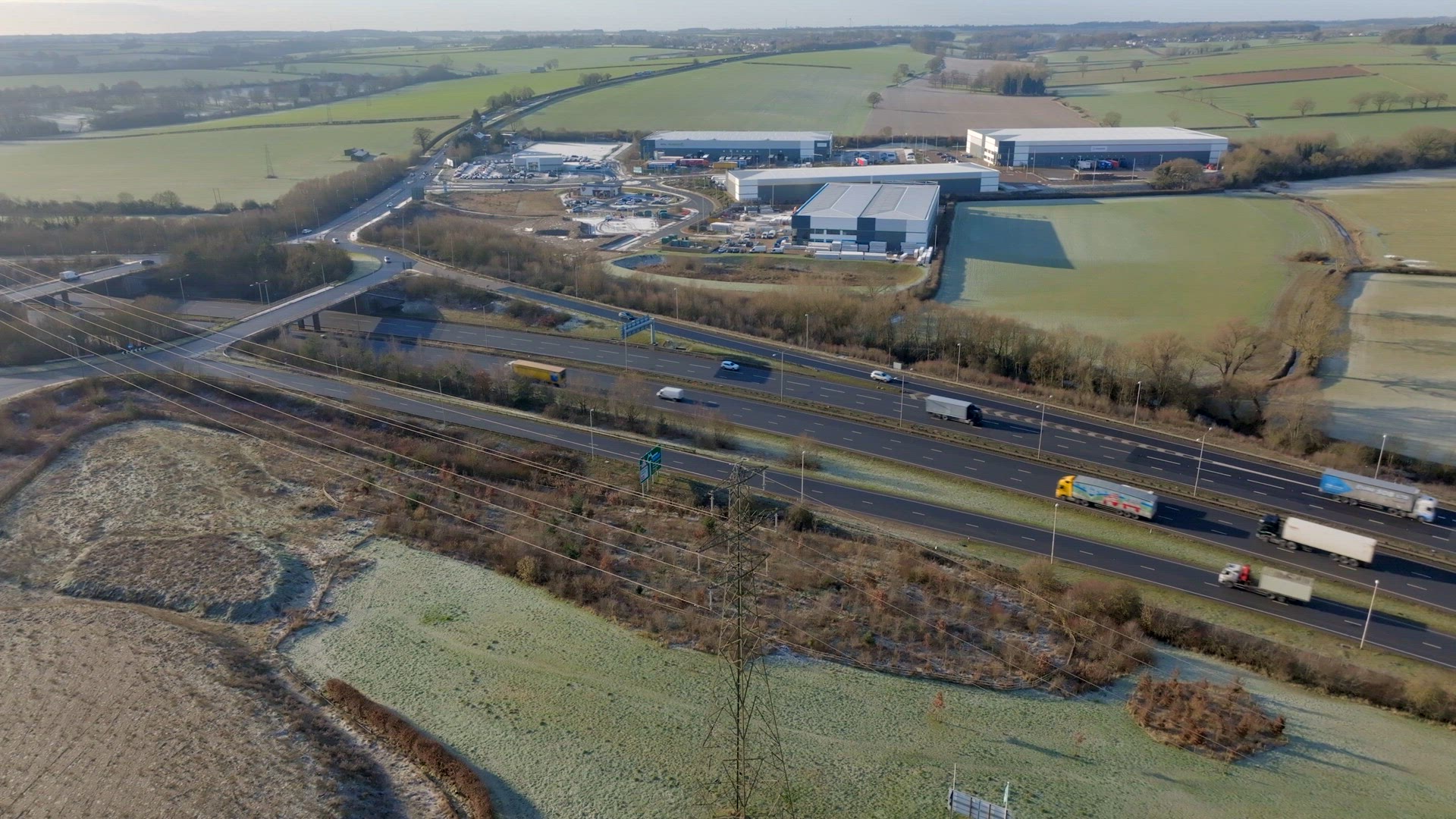 Lorries, Cars and Vehicles Driving on a UK Motorway Aerial View