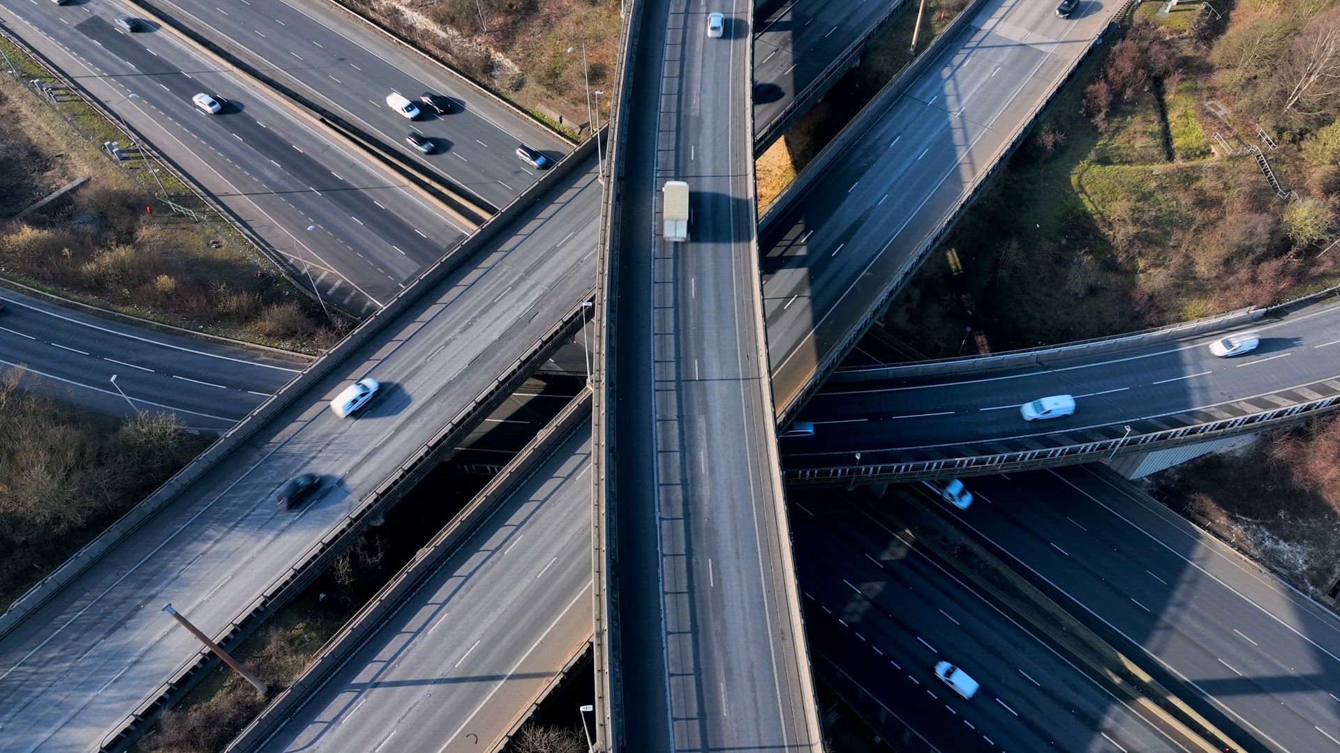 Vehicles Driving Along a Busy Motorway Interchange in the UK Aerial View