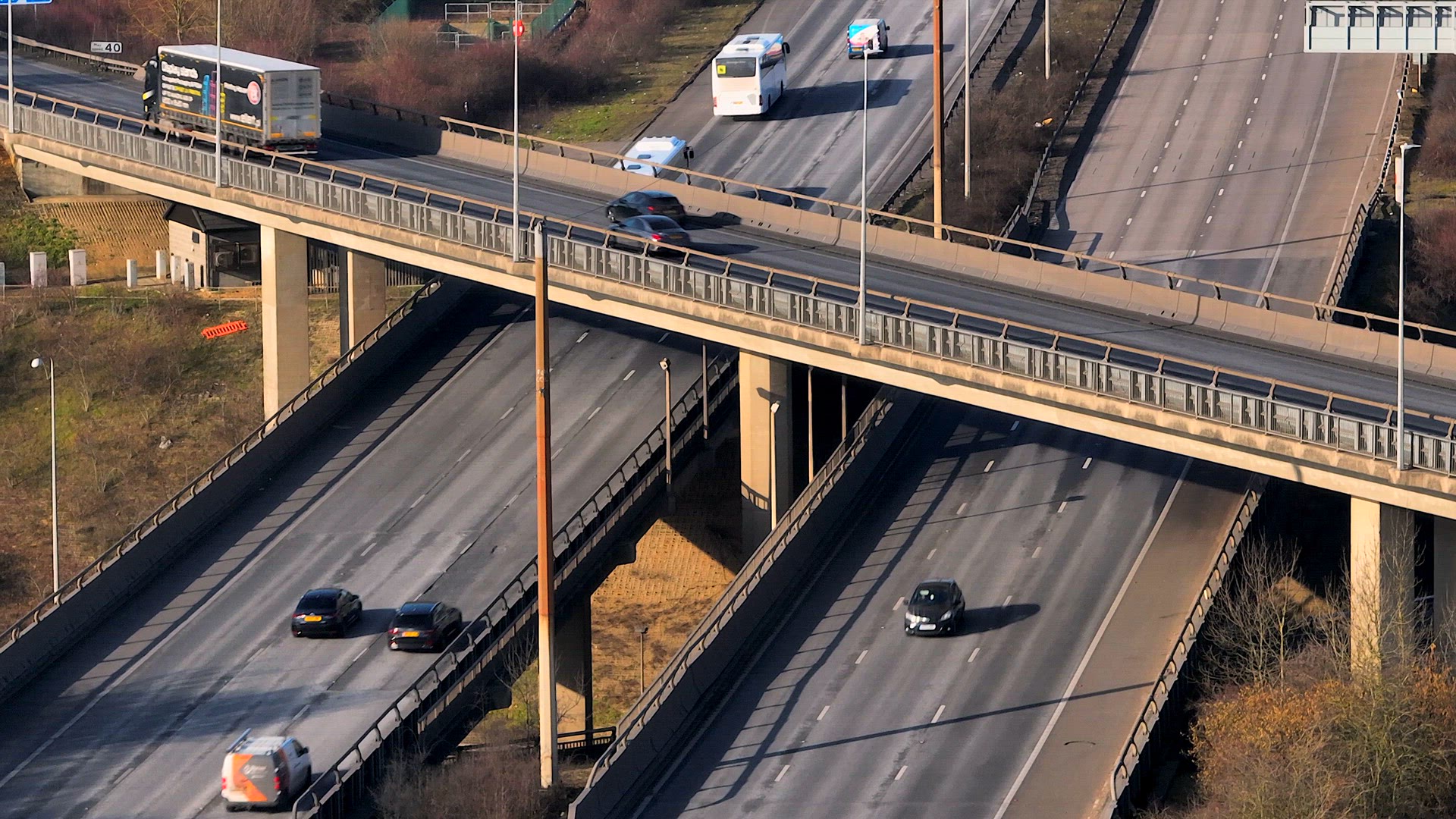 Rush Hour Vehicles Driving on a Motorway Interchange UK Aerial View