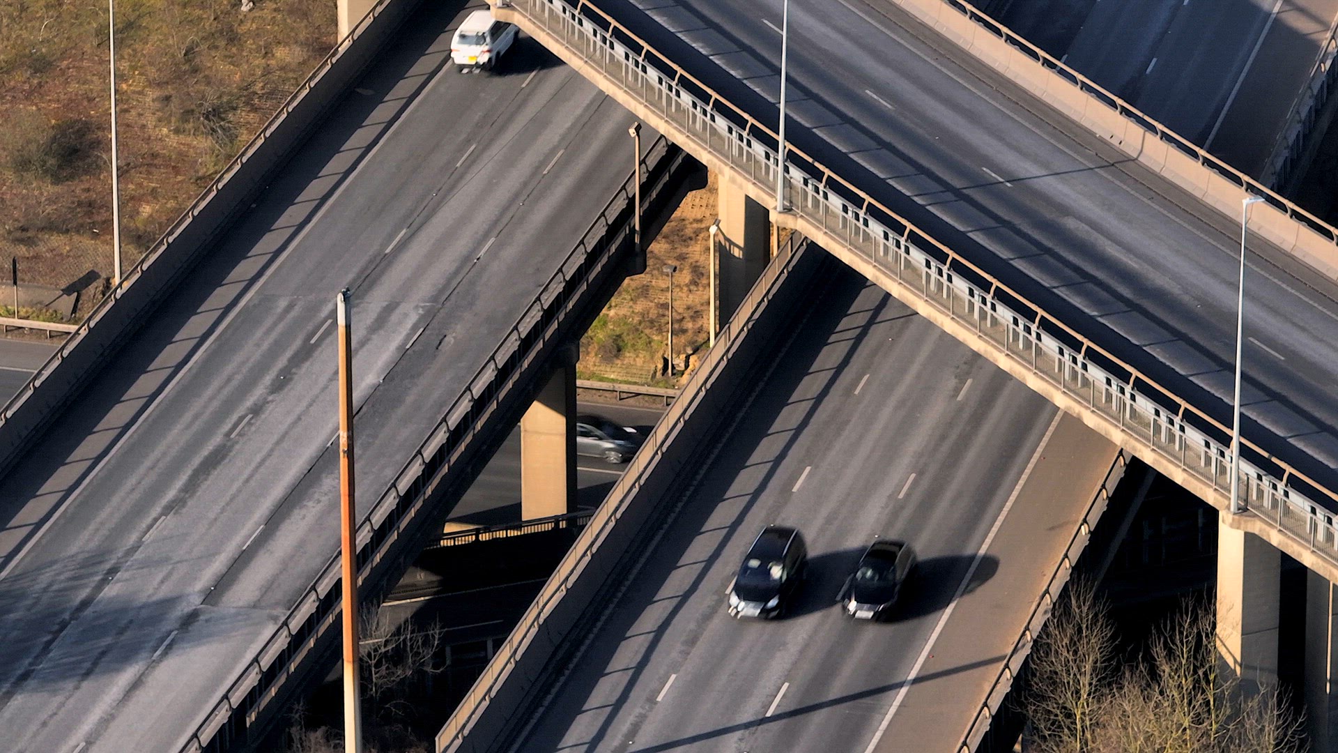 Rush Hour Vehicles Driving on a Motorway Interchange UK Aerial View