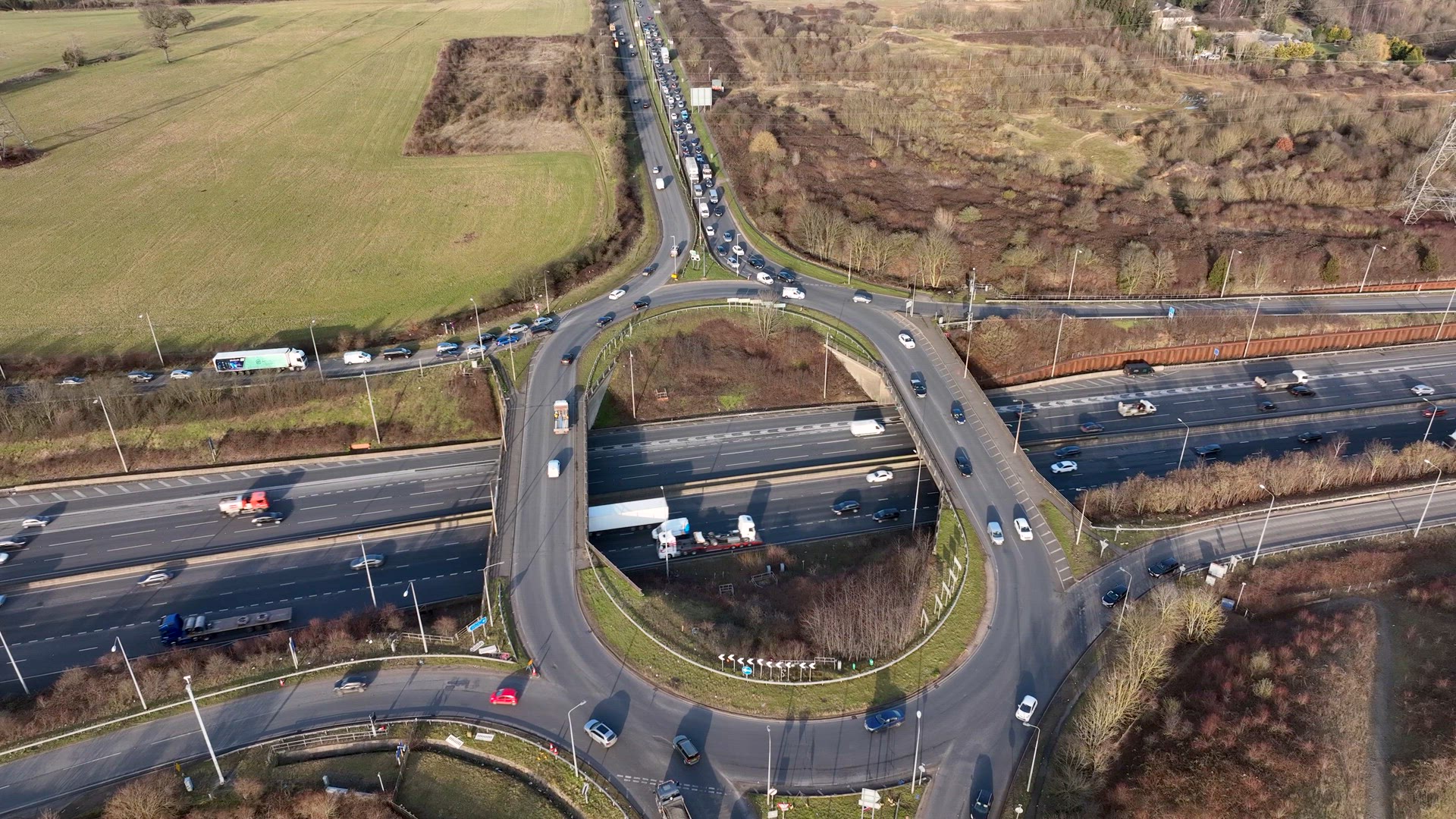 UK M25 Motorway Junction Aerial View at Rush Hour