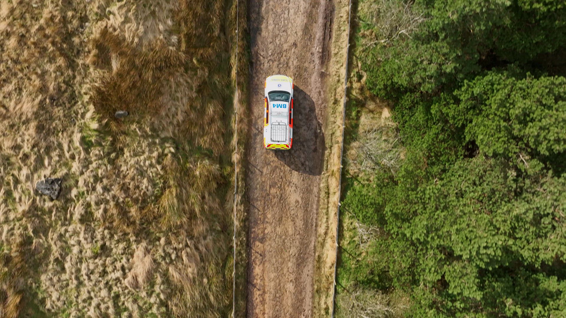 Mountain Rescue Ambulance Vehicle Driving Across Rugged Terrain