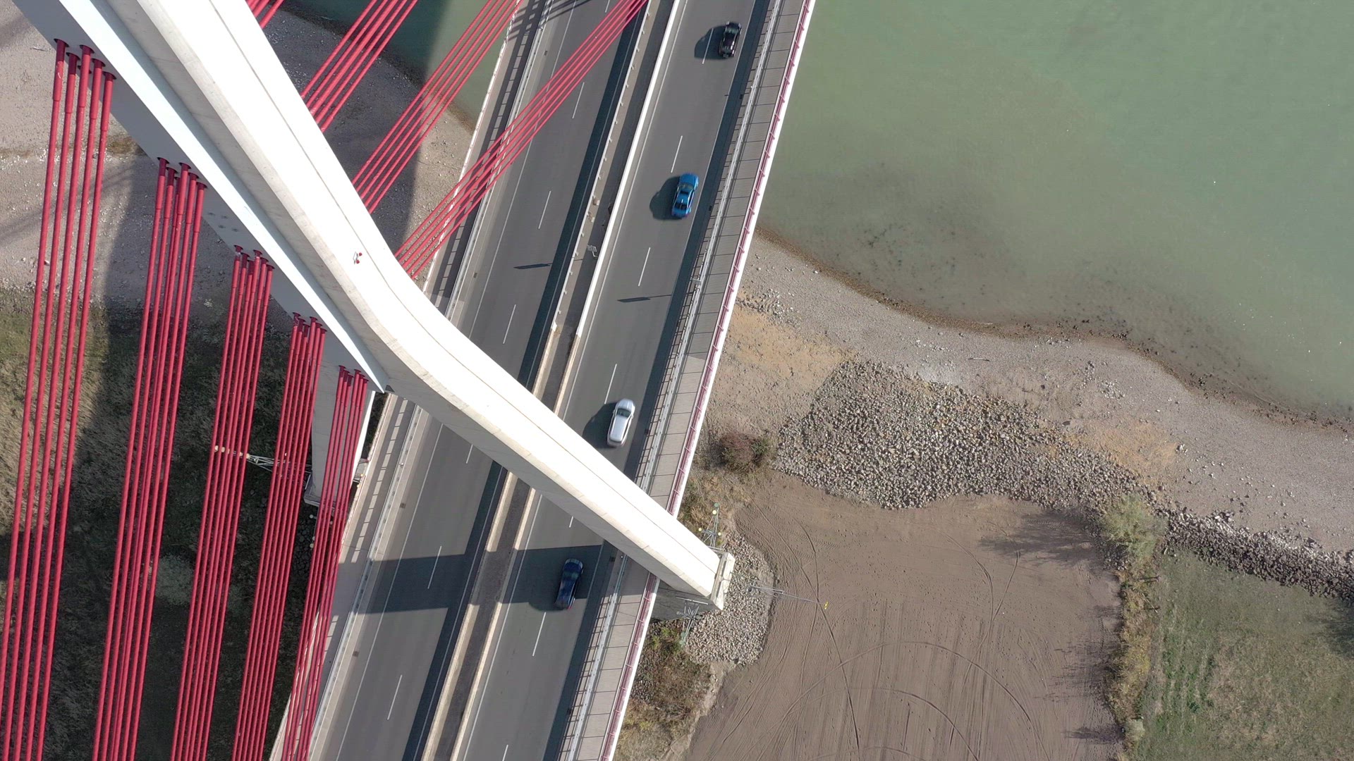 Vehicles Crossing a Cable Stayed Suspension Bridge Crossing a River