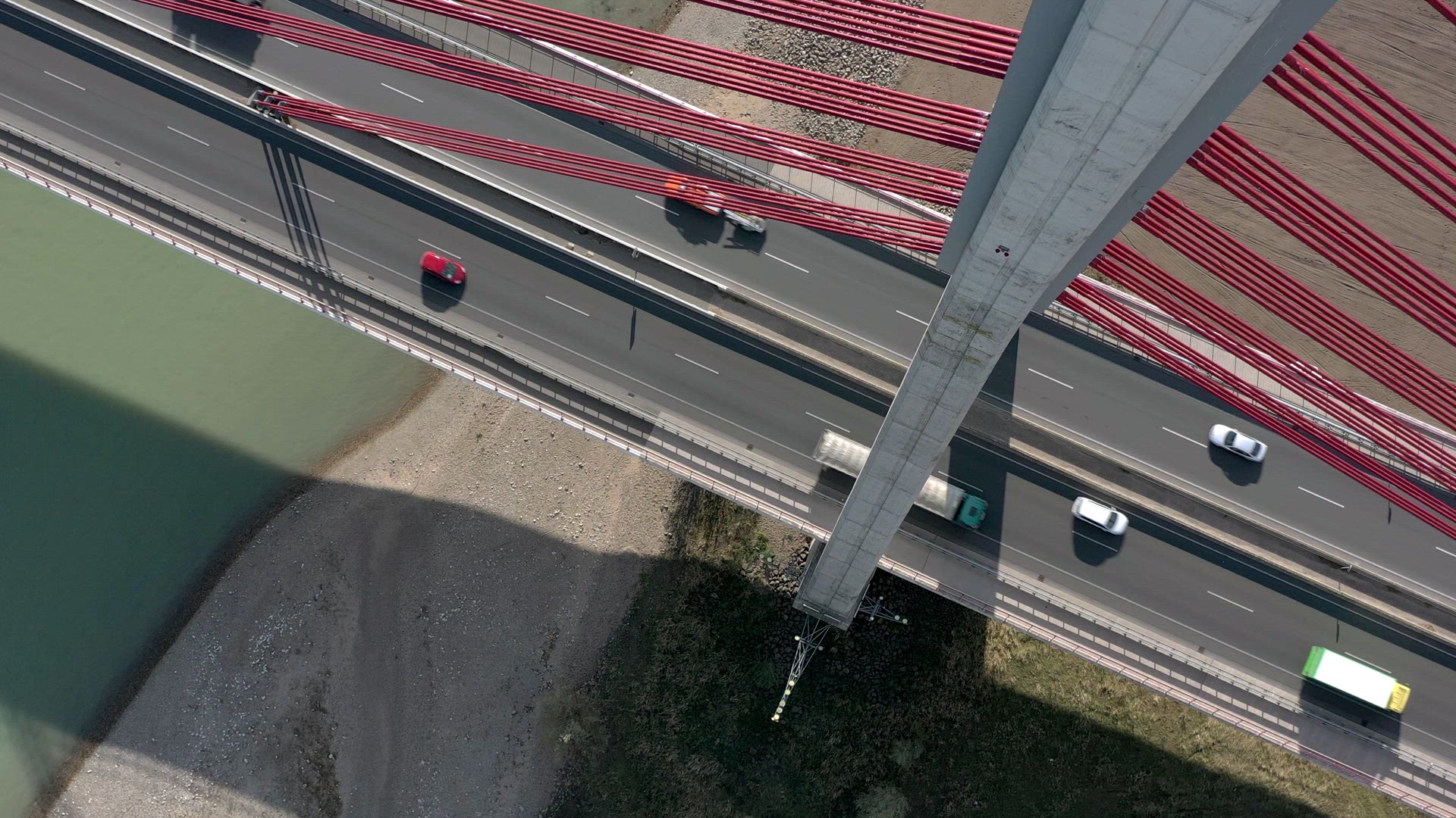 Vehicles Crossing a Cable Stayed Suspension Bridge Crossing a River