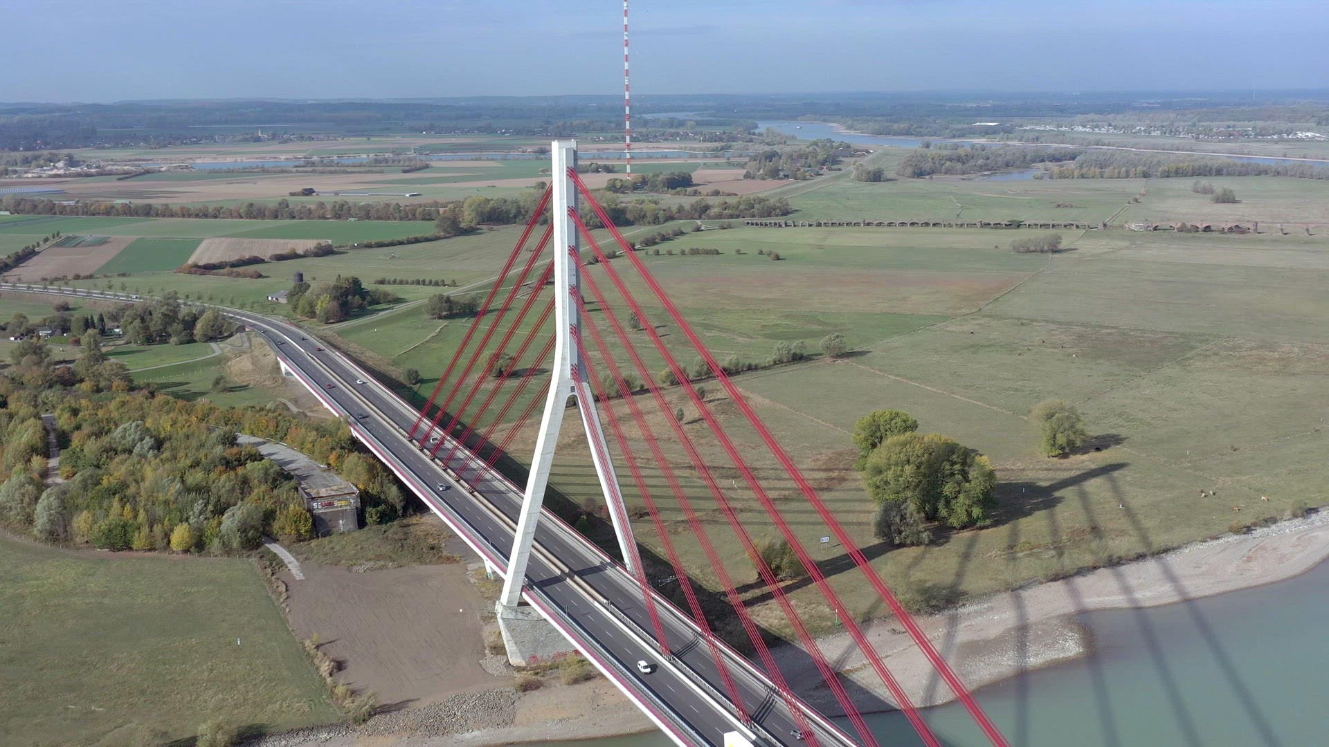Vehicles Crossing a Cable Stayed Suspension Bridge Crossing a River