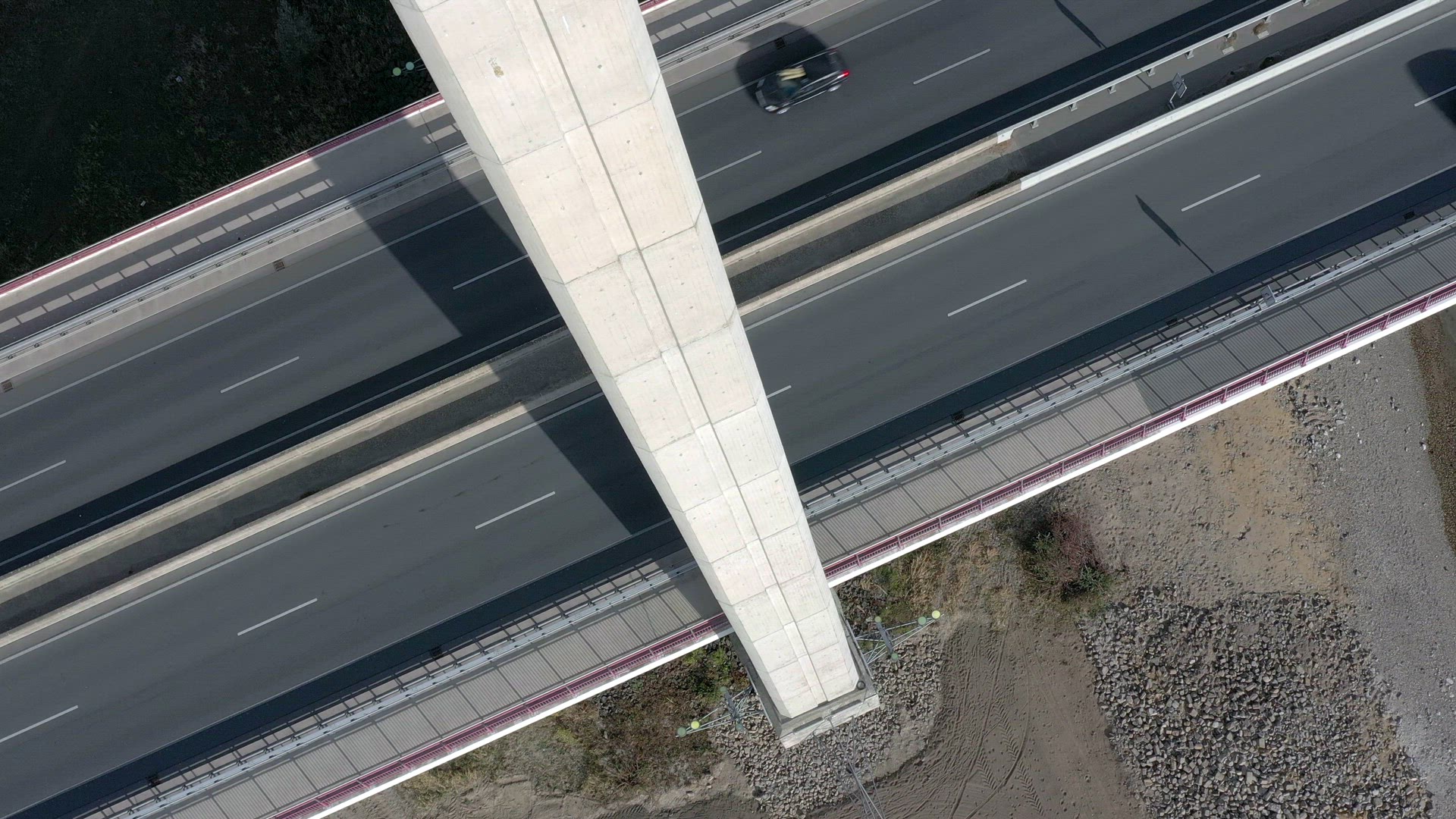 Vehicles Crossing a Cable Stayed Suspension Bridge Crossing a River