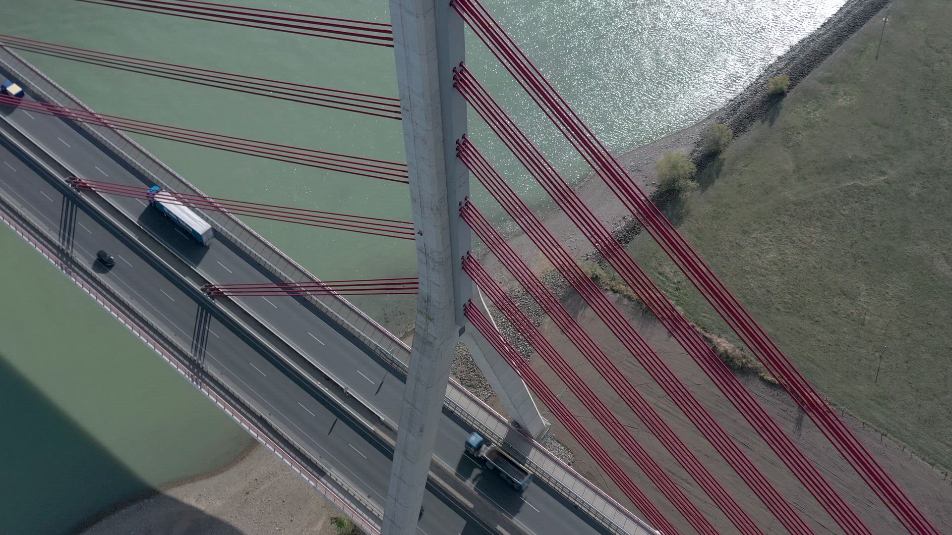 Vehicles Crossing a Cable Stayed Suspension Bridge Crossing a River