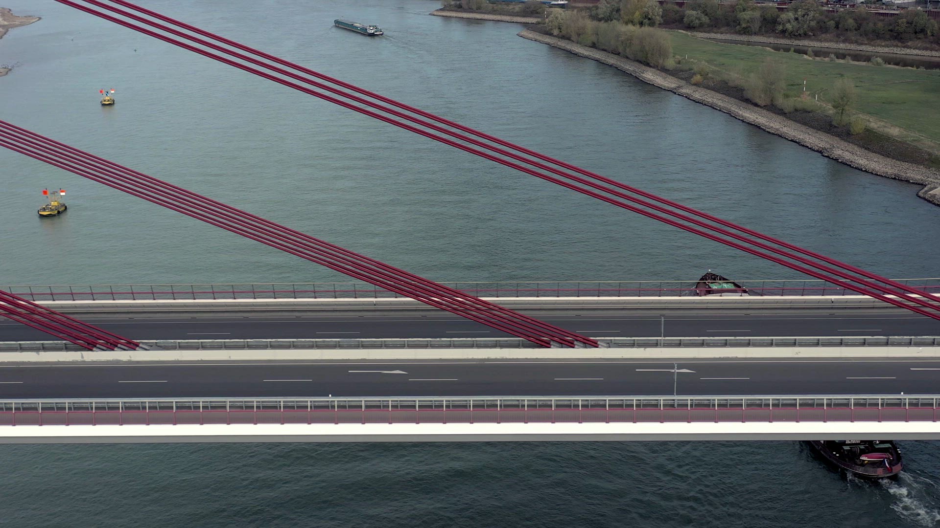 Vehicles Crossing a Cable Stayed Suspension Bridge Crossing a River