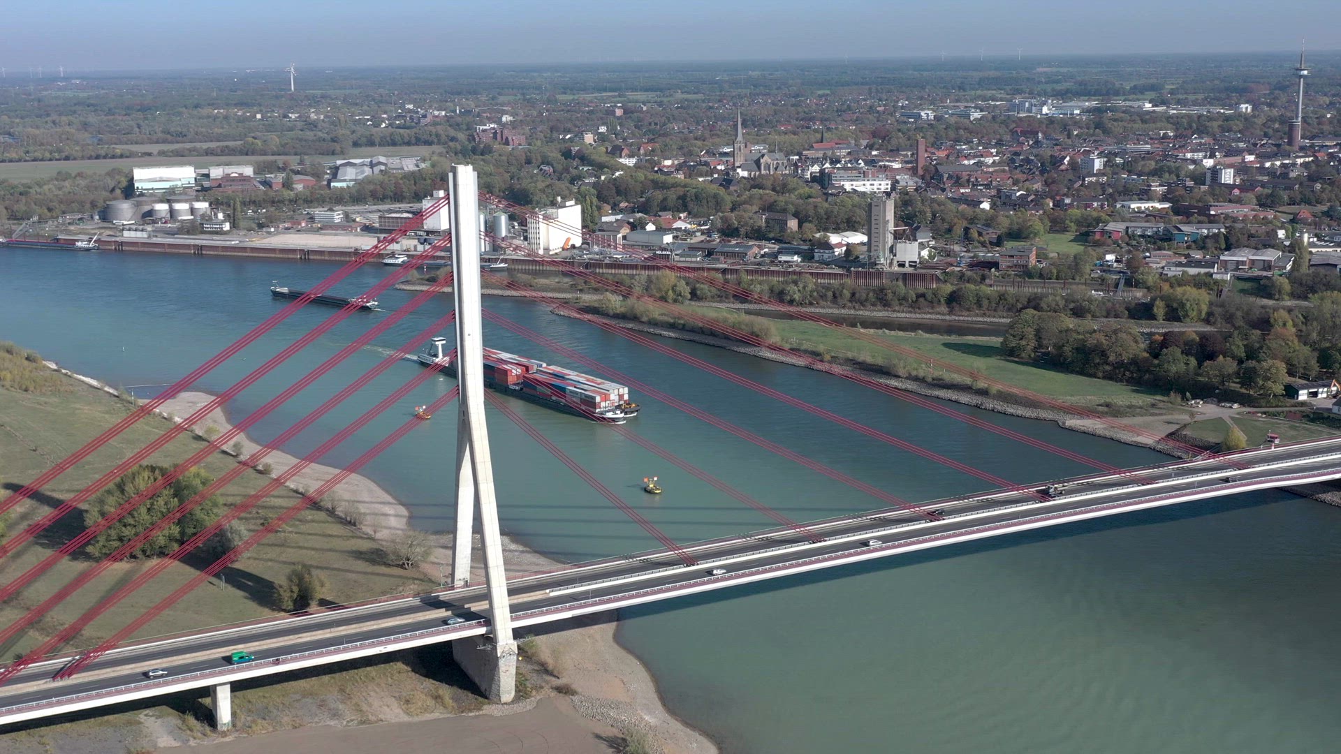 Vehicles Crossing a Cable Stayed Suspension Bridge Crossing a River