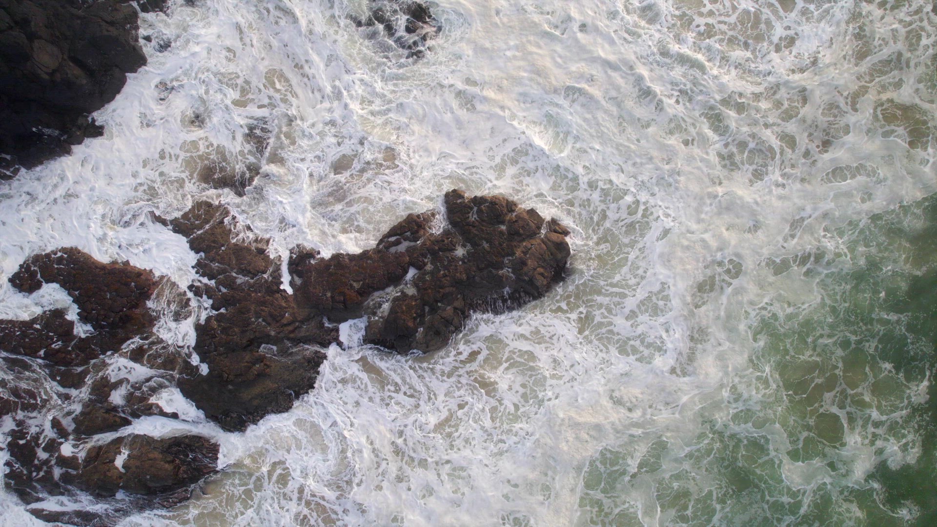 Ocean Waves Crashing Against the Rocky Shores