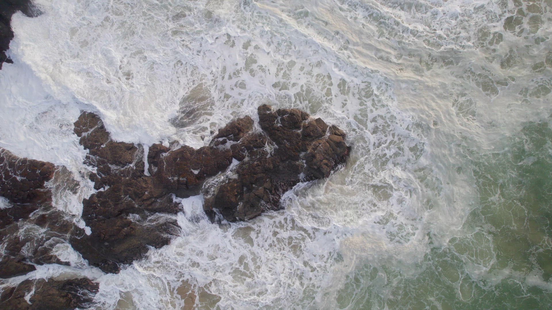 Ocean Waves Crashing Against the Rocky Shores