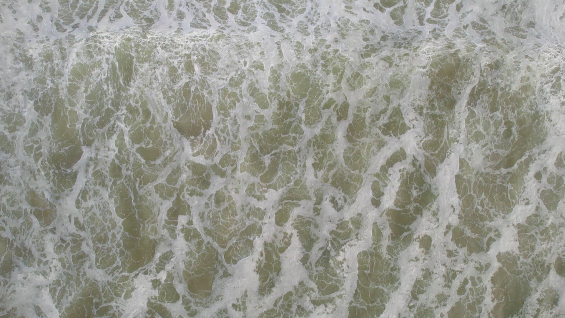White Water Created By Waves Crashing on to the Beach