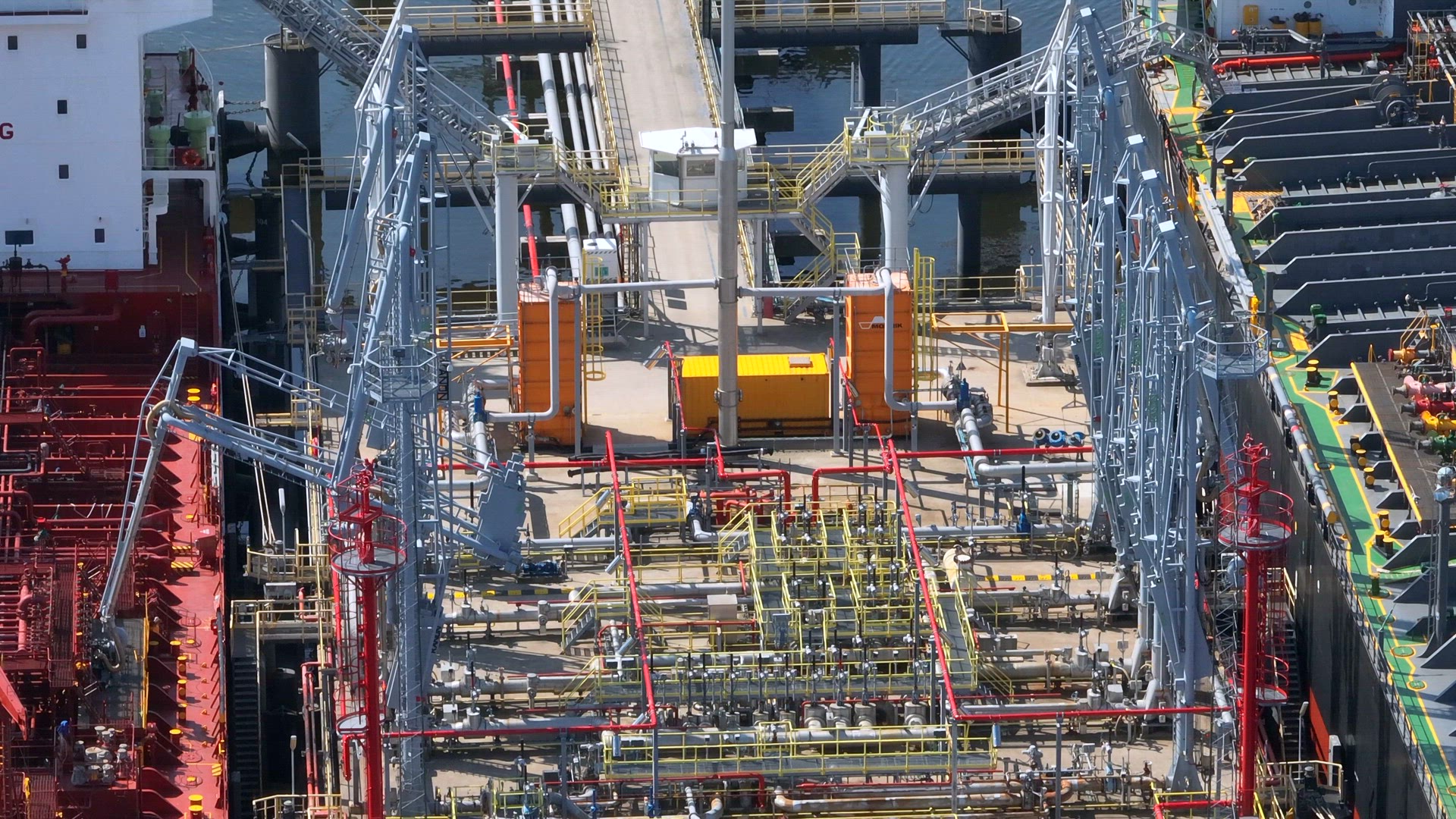 Liquid Cargo Transporter Ship Unloading Crude Oil to a Fuel Depot