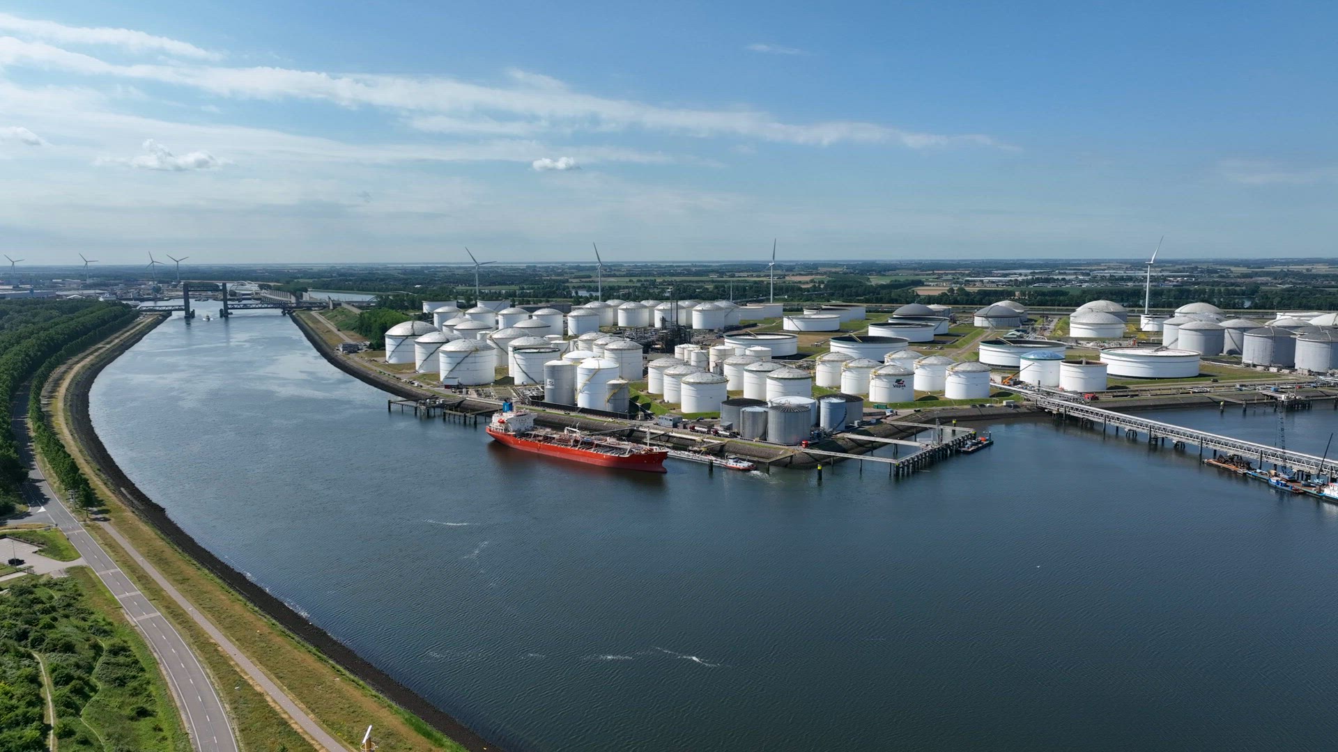 Liquid Cargo Transporter Ship Unloading Crude Oil to a Fuel Depot