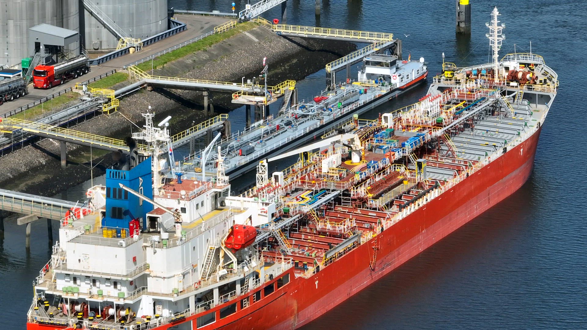 Liquid Cargo Transporter Ship Unloading Crude Oil to a Fuel Depot