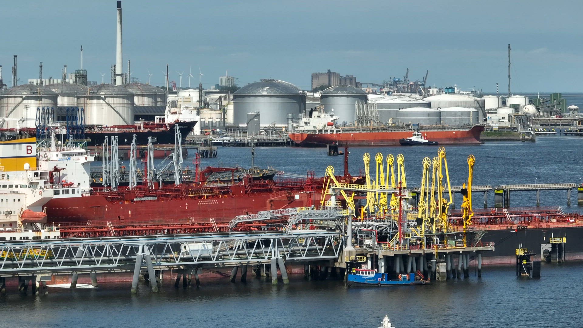 Liquid Cargo Transporter Ships Unloading Crude Oil to a Fuel Depot
