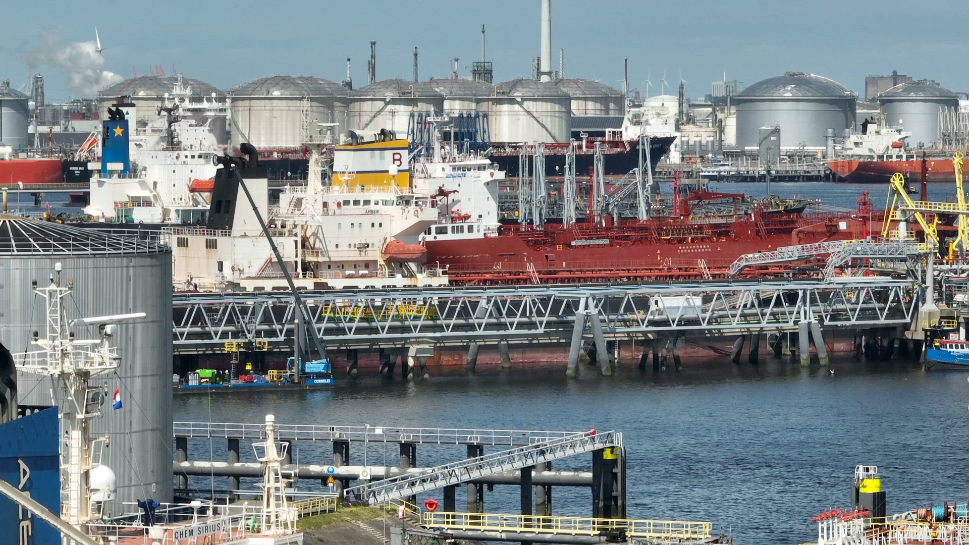 Liquid Cargo Transporter Ships Unloading Crude Oil to a Fuel Depot