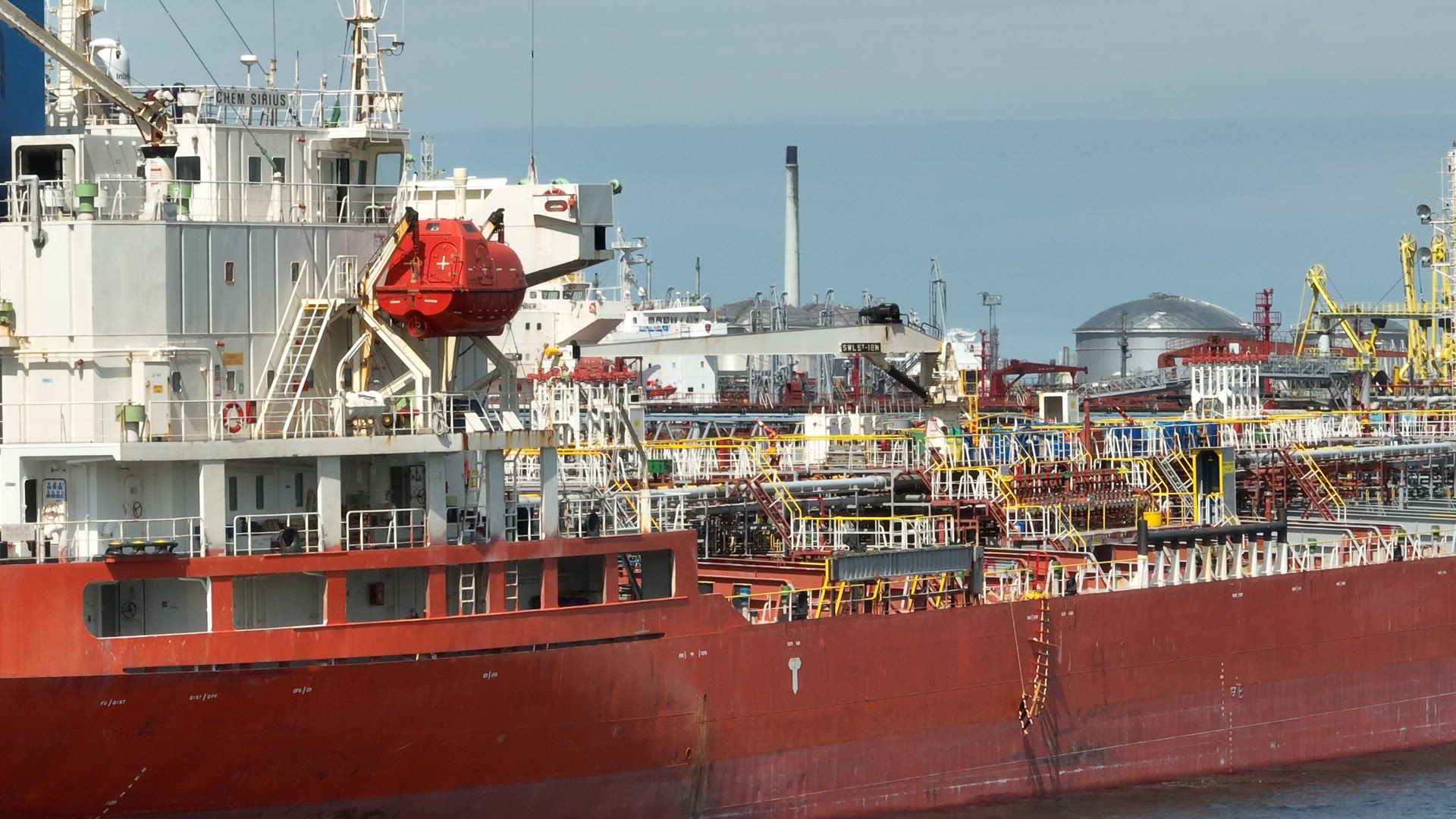 Liquid Cargo Transporter Ships Unloading Crude Oil to a Fuel Depot