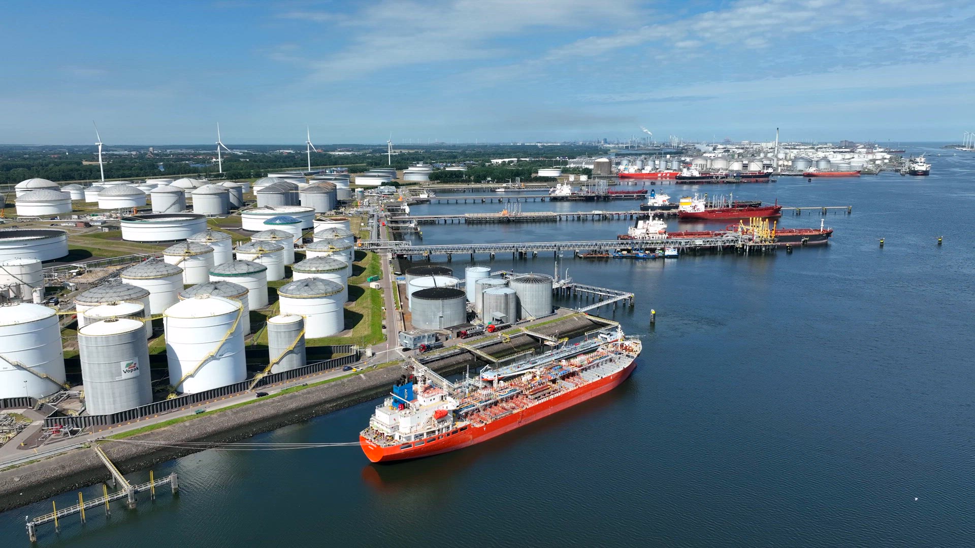 Crude Oil Tanker Vessel Unloading Petrochemicals to a Shore Fuel Depot