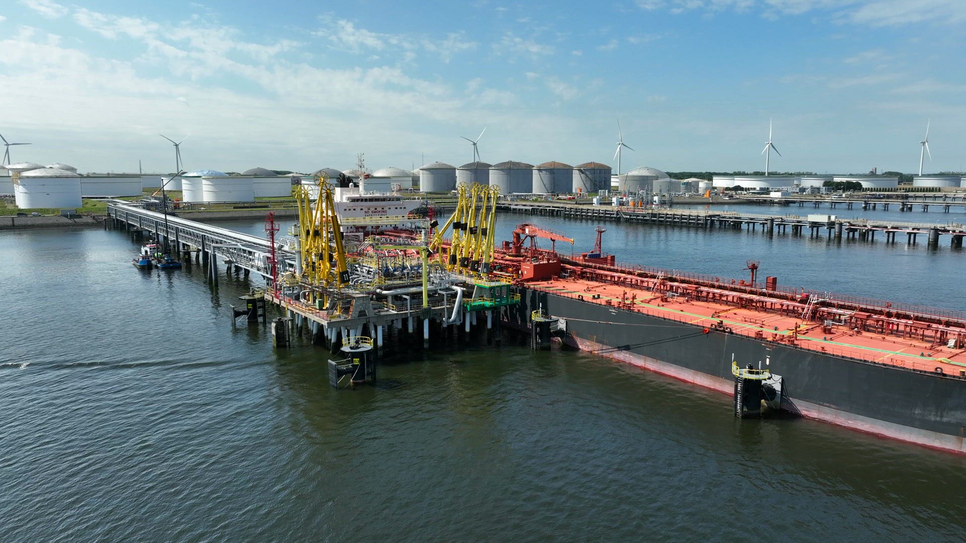 Crude Oil Liquid Cargo Transporter Ship Unloading Petrochemicals to a Fuel Depot