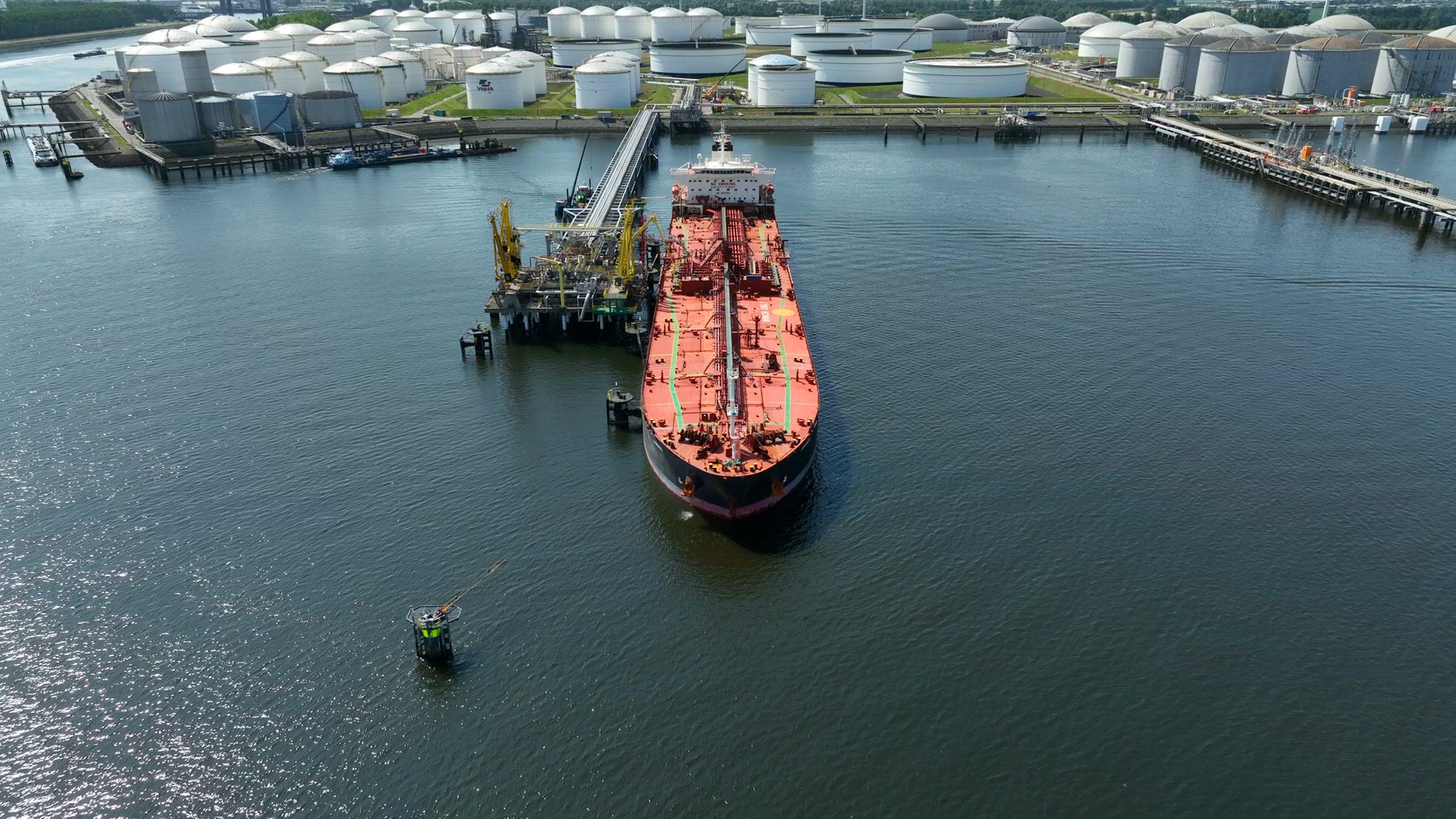 Crude Oil Tanker Ships Unloading Petrochemicals to a Shore Fuel Depot