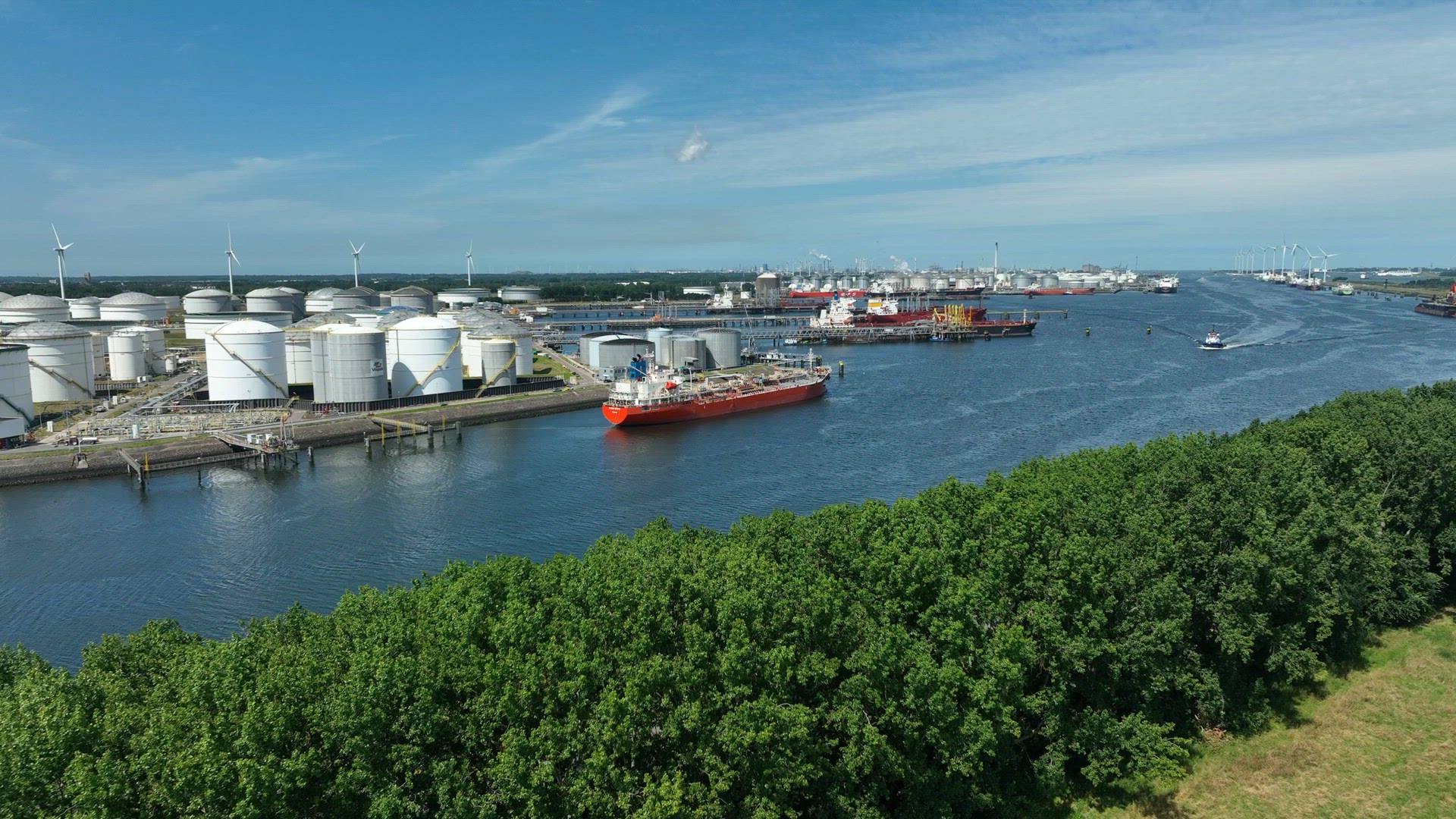 Crude Oil Tanker Vessel Unloading Petrochemicals to a Shore Fuel Depot
