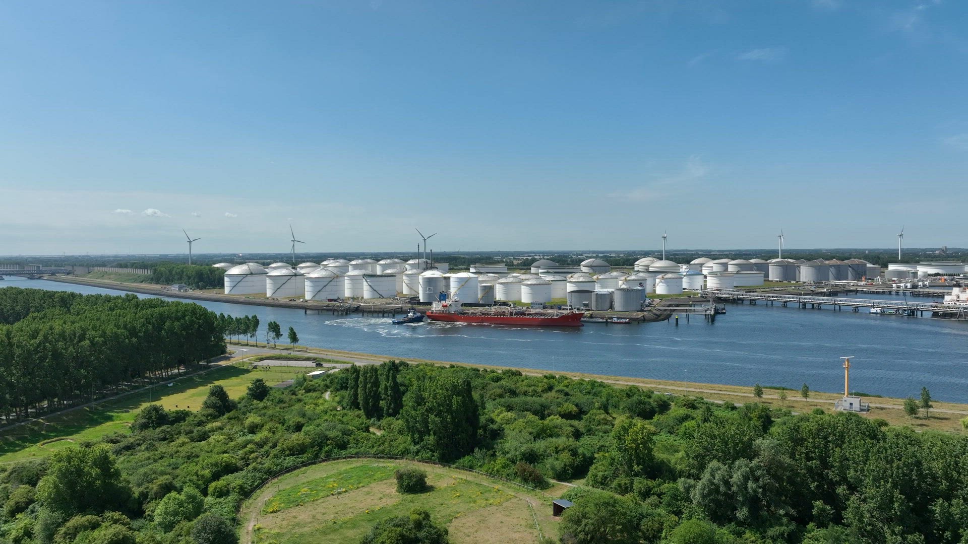 Crude Oil Tanker Vessel Unloading Petrochemicals to a Shore Fuel Depot