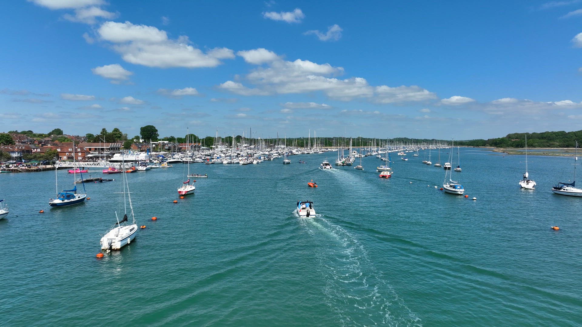 Yachts, Speedboats and Vessels on a River in the Summer