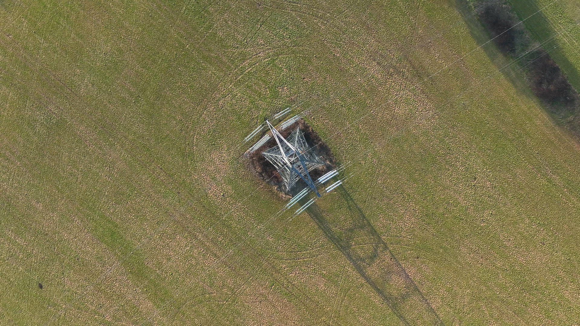 Bird's Eye View of Industrial High Voltage Lattice Power Line Tower