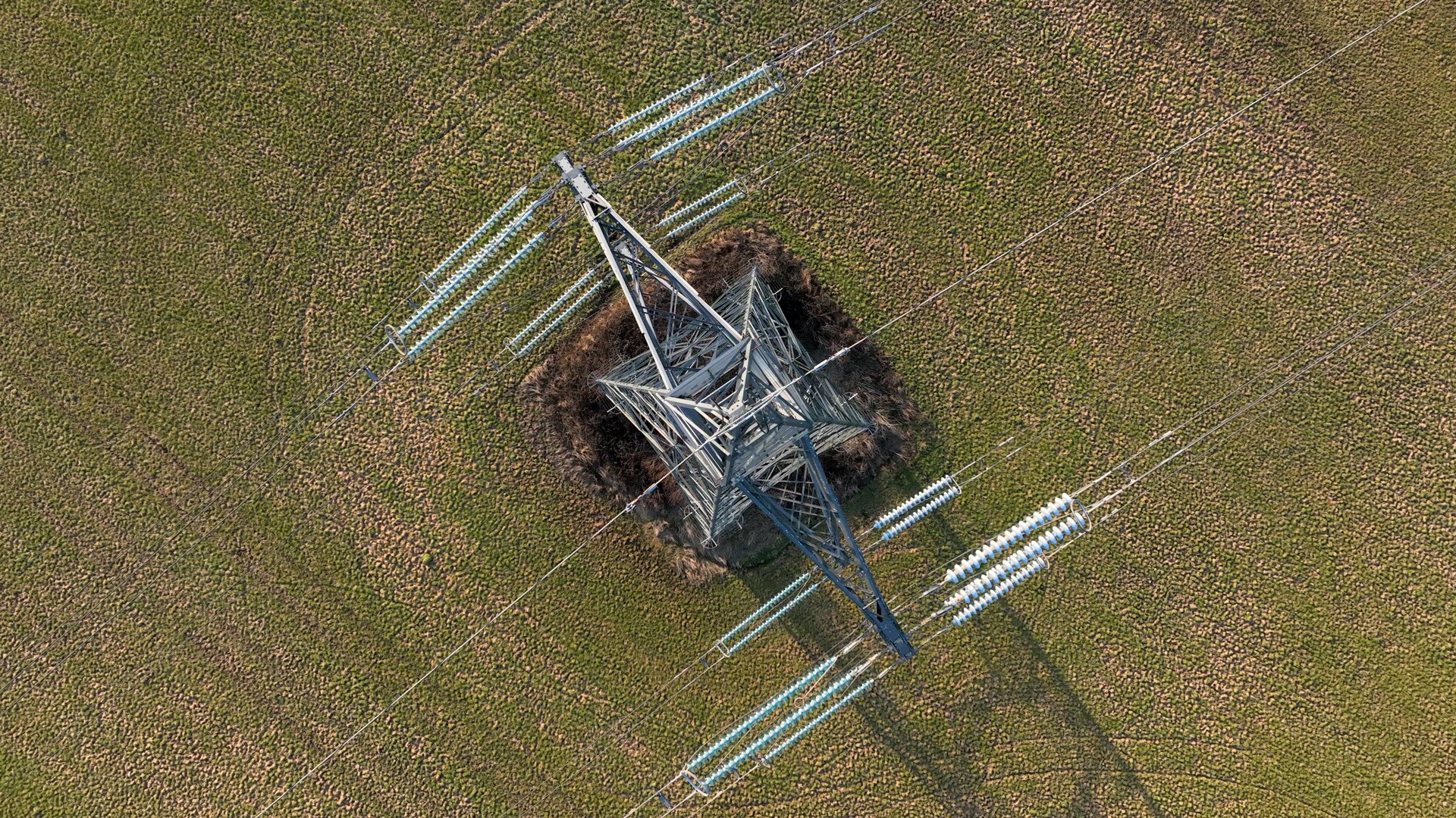 Bird's Eye View of Industrial High Voltage Lattice Power Line Tower