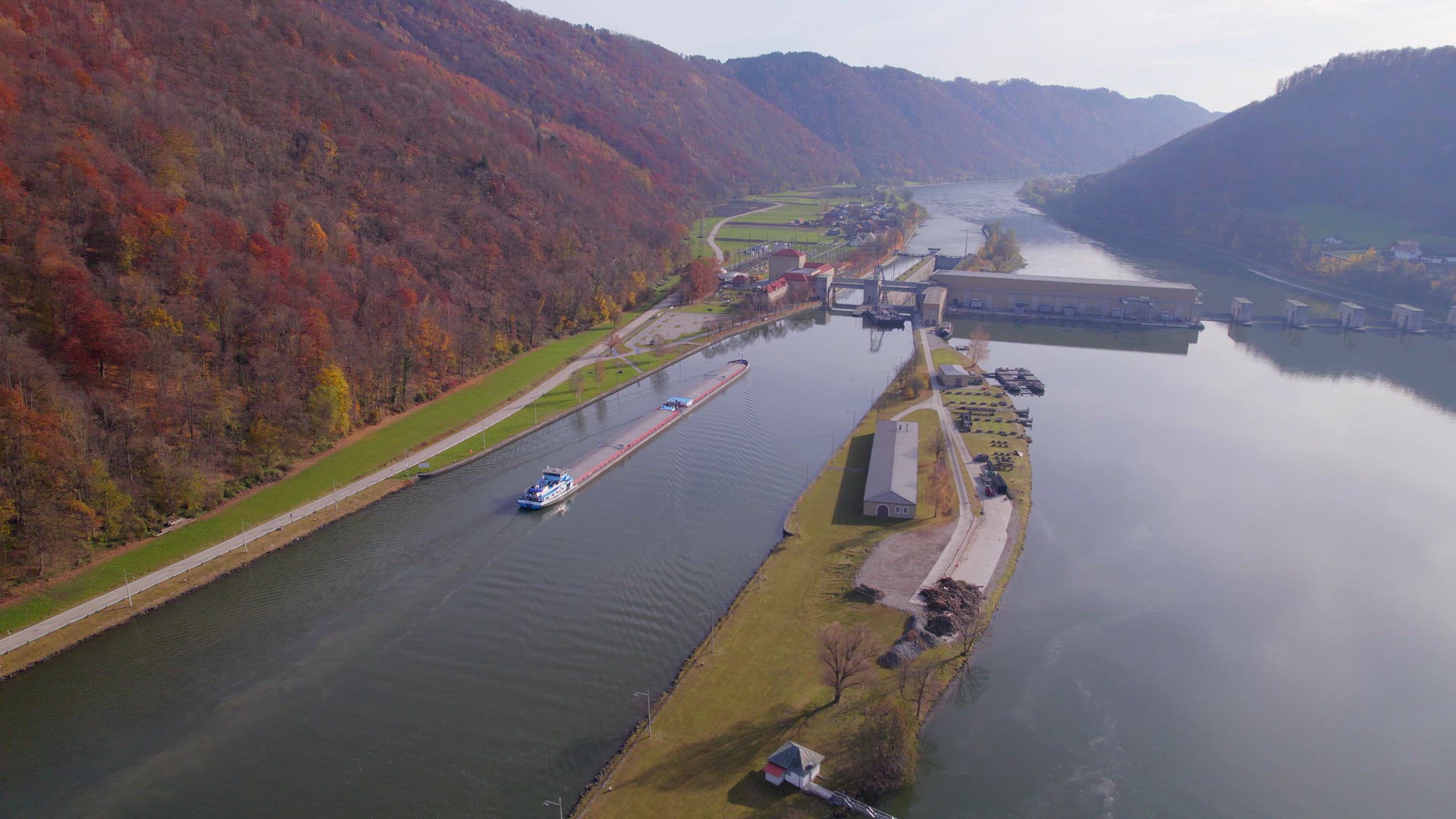 Cargo Pusher Transport Boat Traversing a Lock Moving Freight and Goods