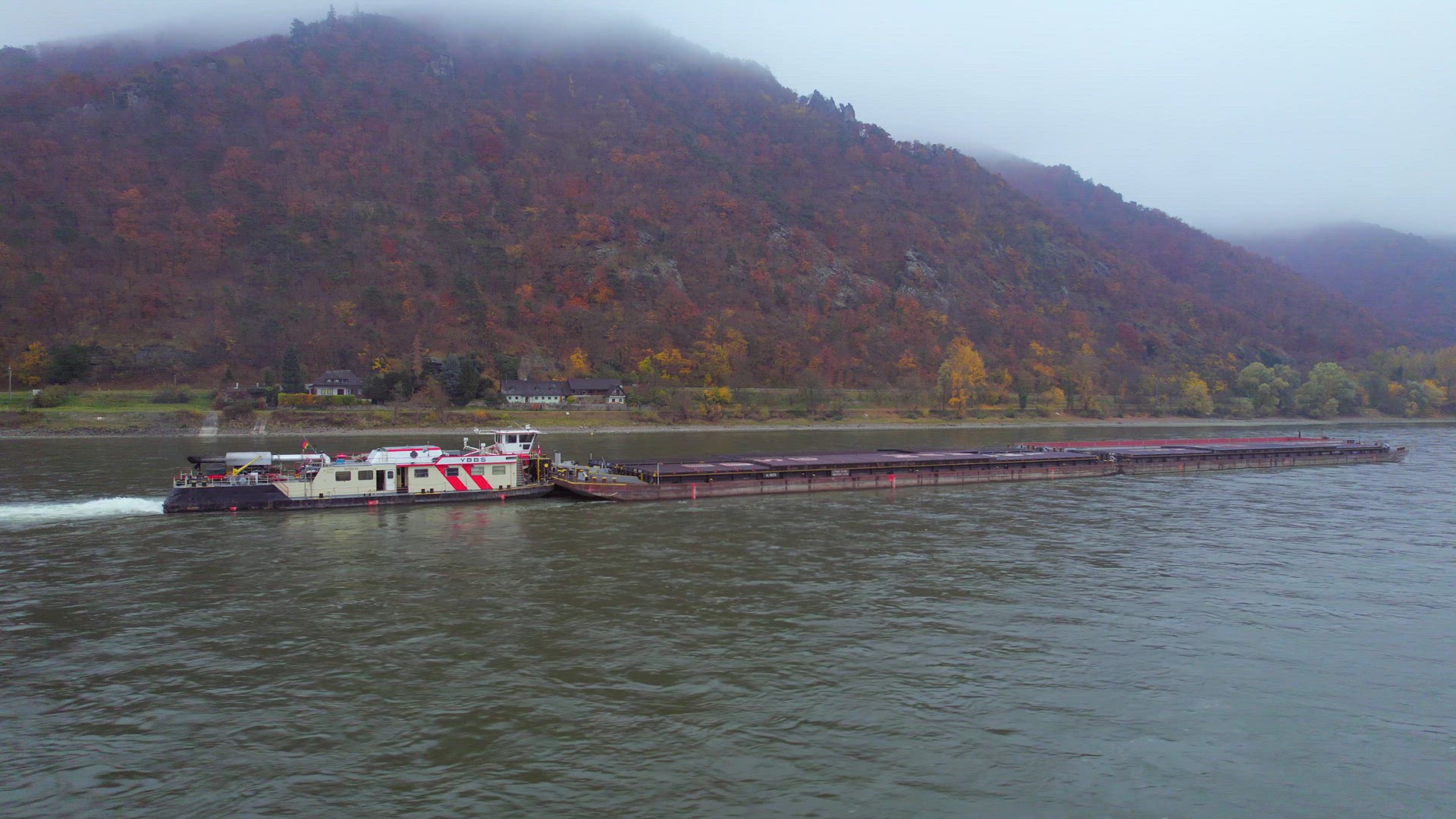 Cargo Pusher Boat on a River Transporting Cargo and Goods