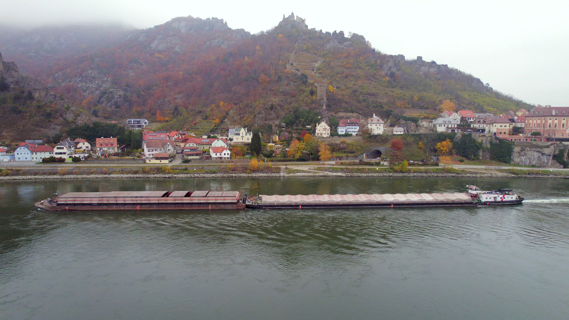 Cargo Pusher Boat on a River Transporting Cargo and Goods