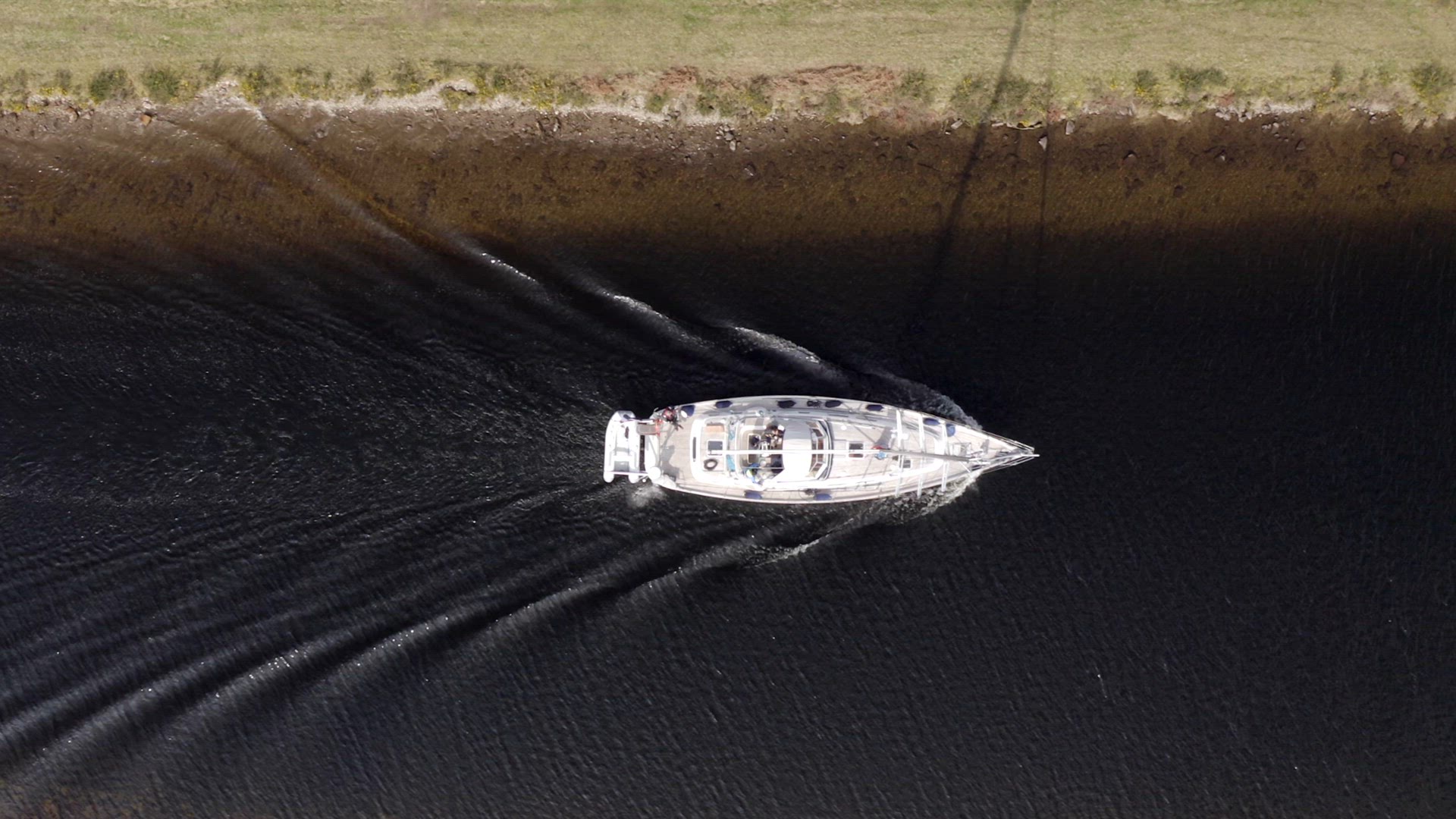 A Yacht Motoring Along a Canal Bird's Eye View