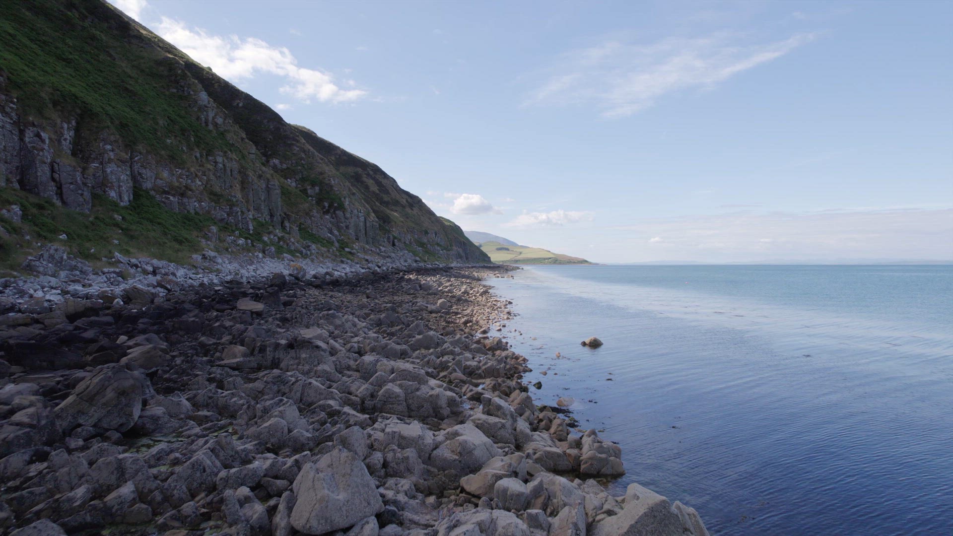Low Flight Along The Shores of the Holy Isle in Scotland