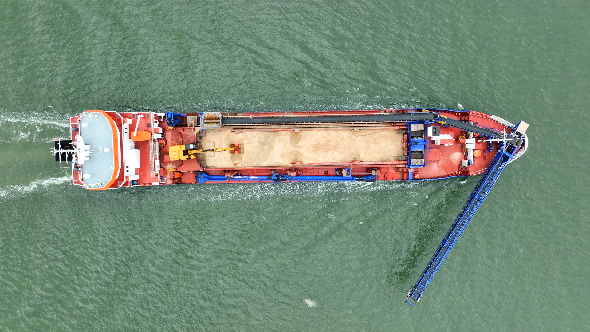 Self Unloading Barge Carrying Cargo At Sea