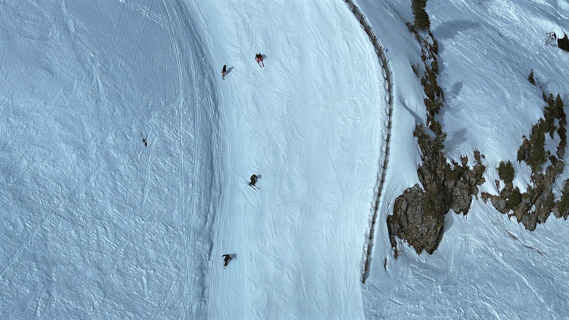 Skiers and Snowboarders on a Ski Run in a Resort Aerial View