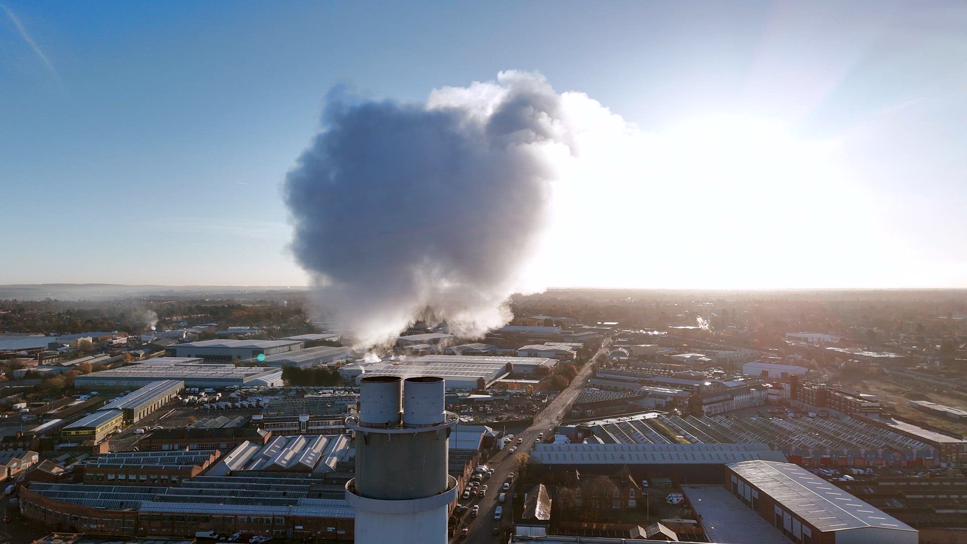 Smoke Bellows From an Industrial Chimney Contributing To Climate Change