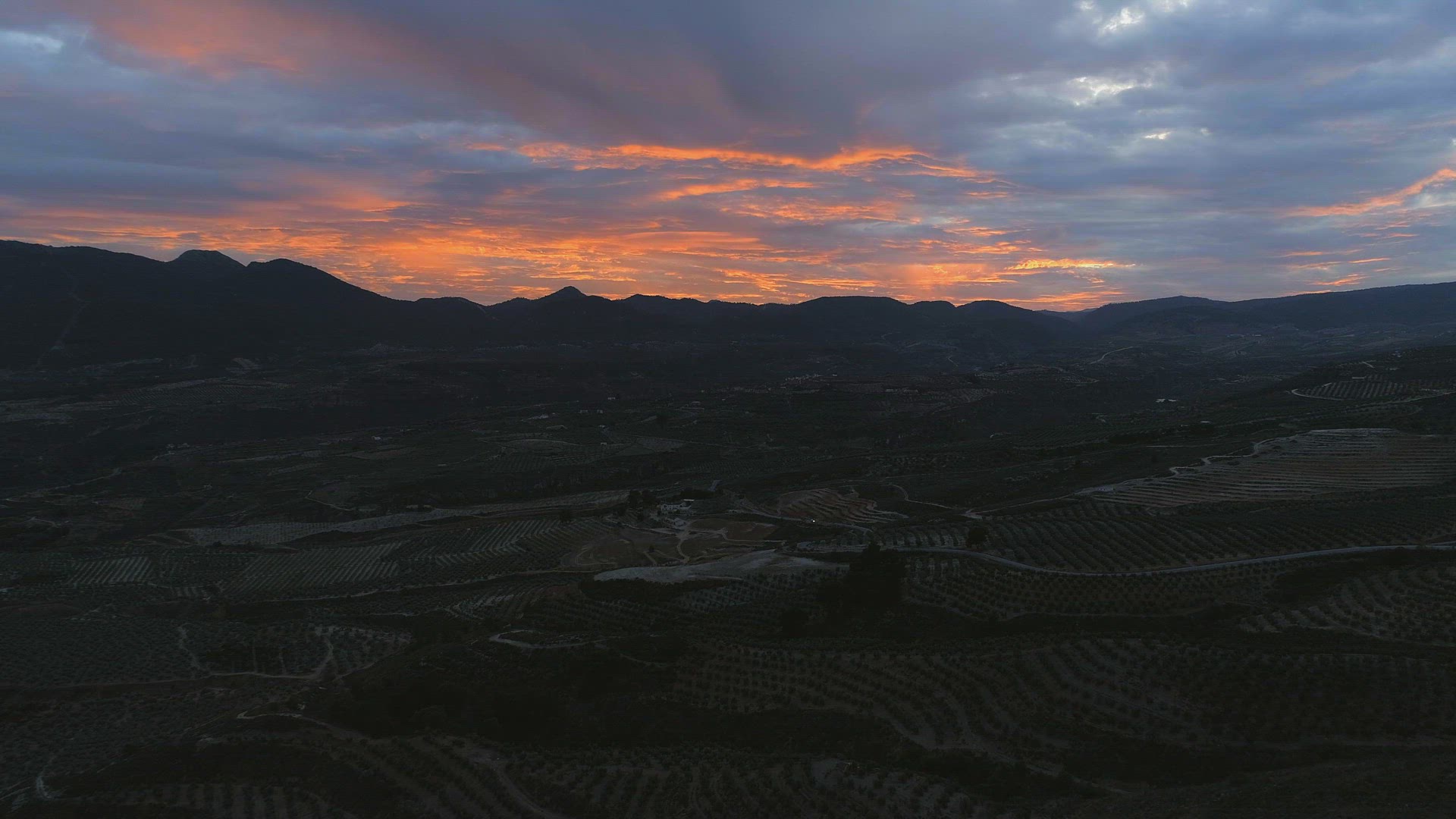 Sunset Over Spanish Mountains and Farms