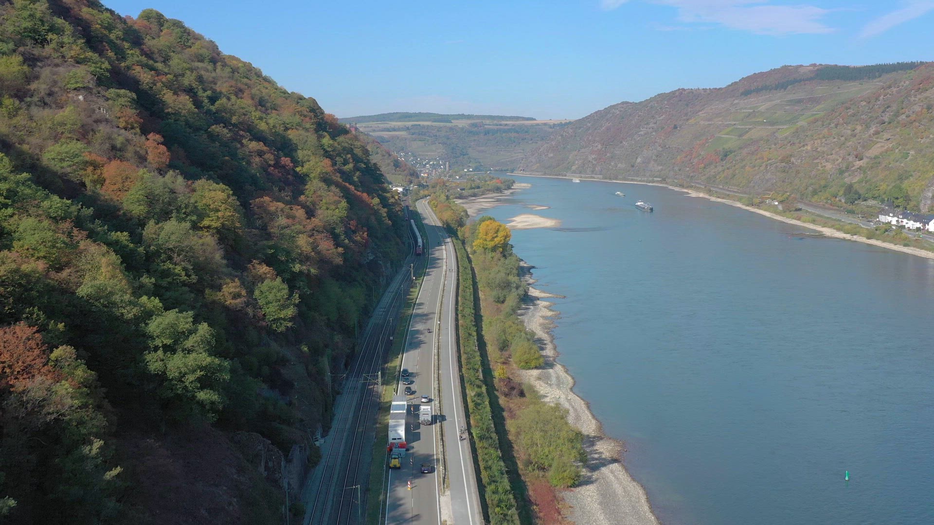 Commuter Train Passing Through a River Valley