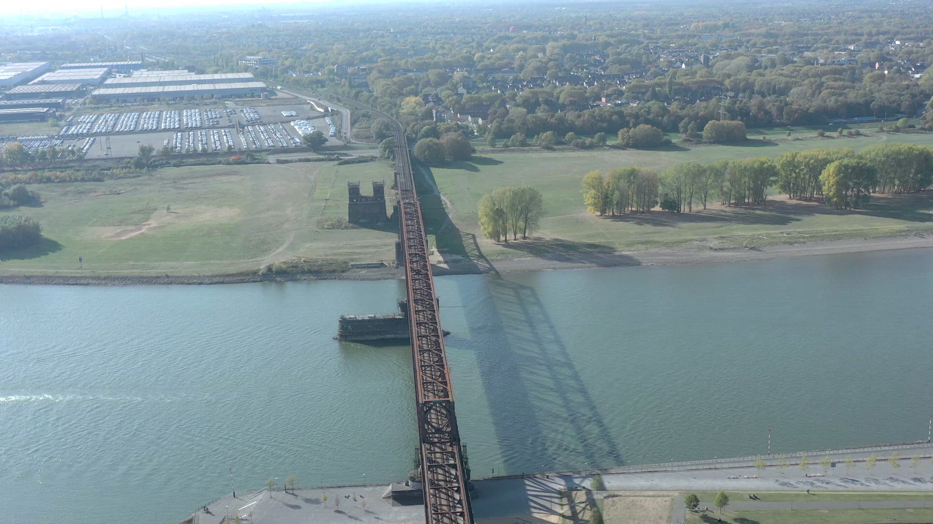 Commuter Train Passing Over an Old Iron Bridge