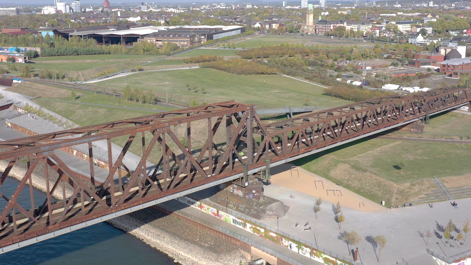 Commuter Train Passing Over an Old Iron Bridge
