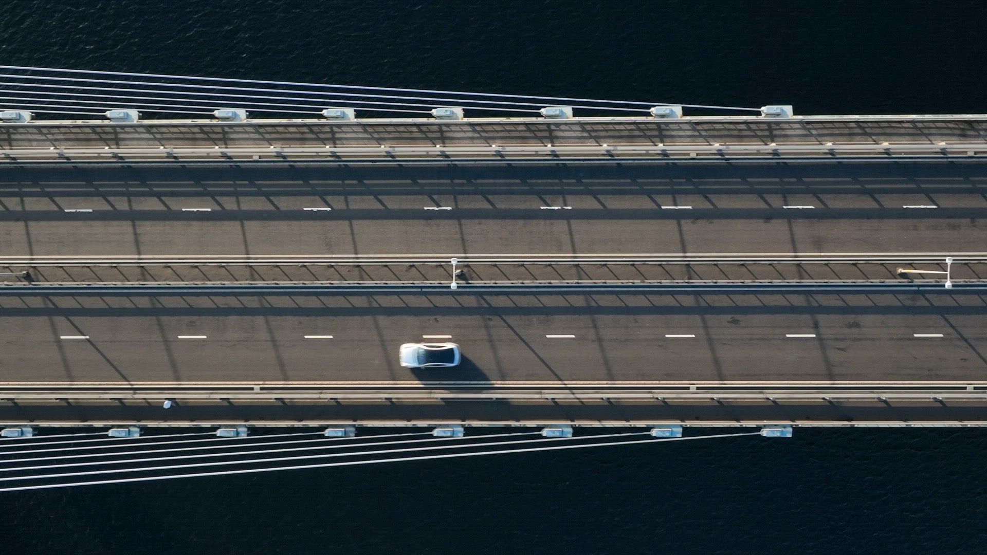 Vehicles Crossing a Suspension Cable Stayed Bridge in Slow Motion