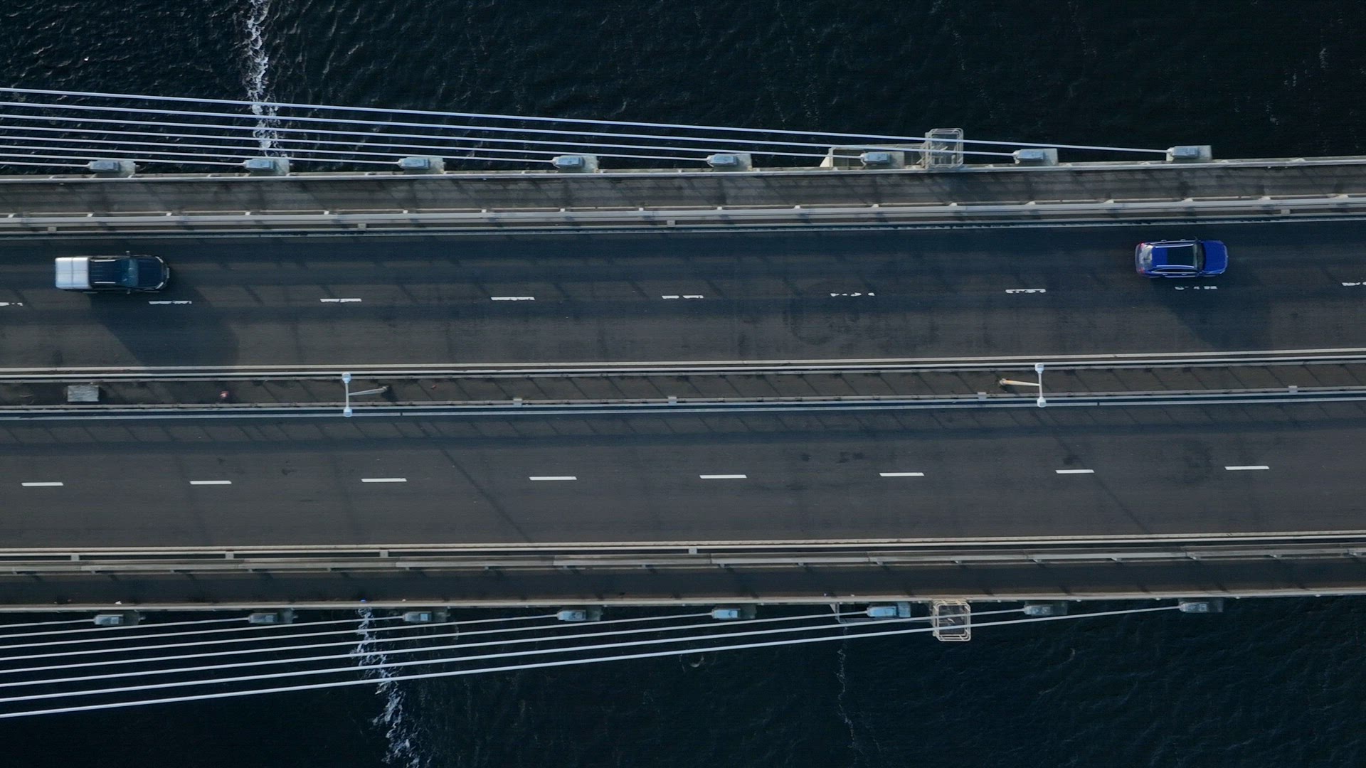 Vehicles Crossing a Suspension Cable Stayed Bridge in Slow Motion