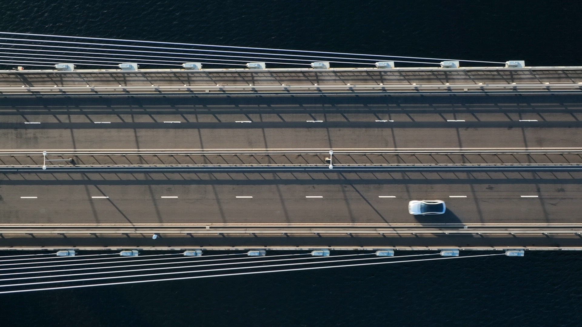 Vehicles Crossing a Suspension Cable Stayed Bridge in Slow Motion
